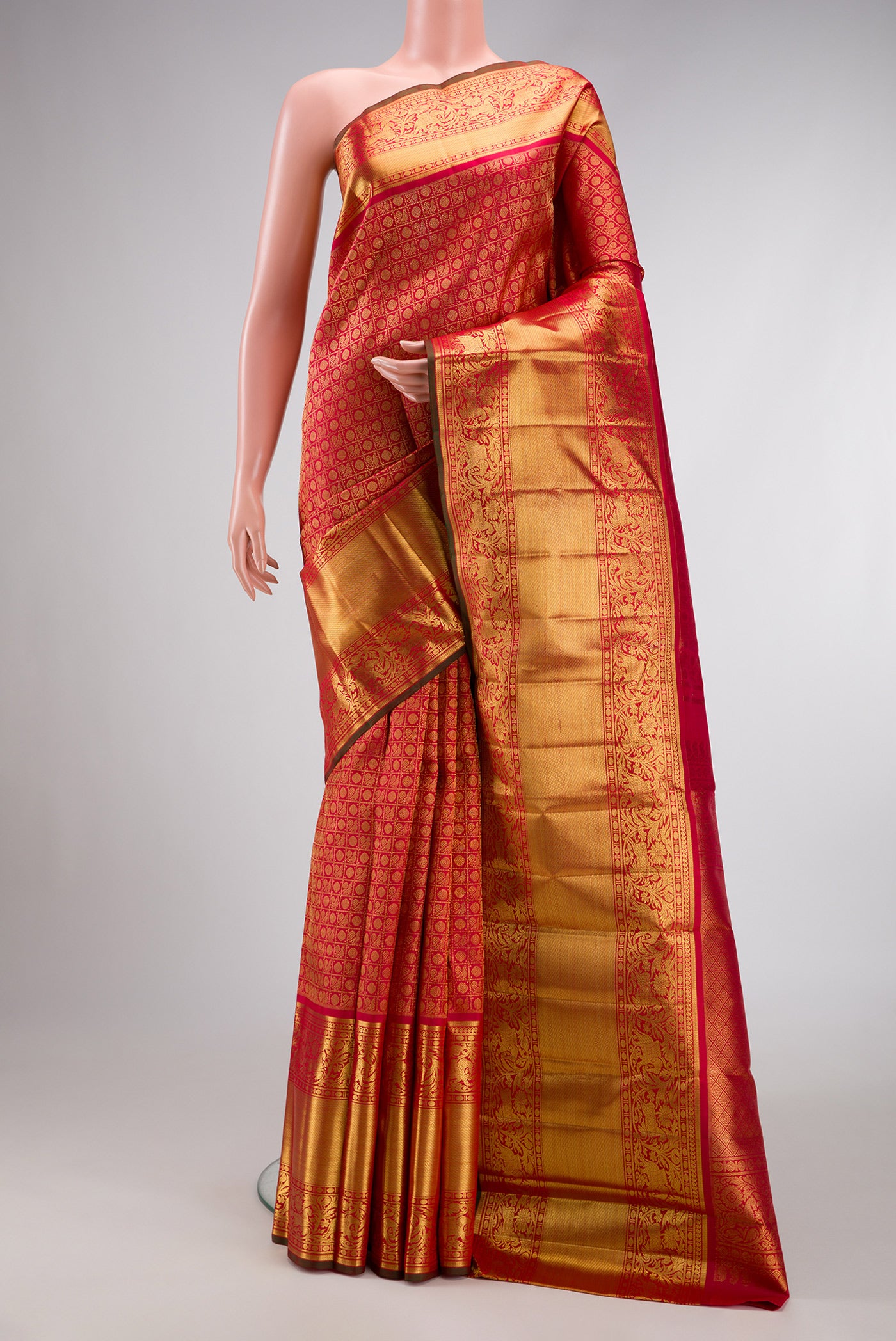 Pure Silk Pure Zari Dark Pink Dual Tone Kanjivaram Saree with Zari Brocade on the body and Fancy Border.  displayed on a mannequin