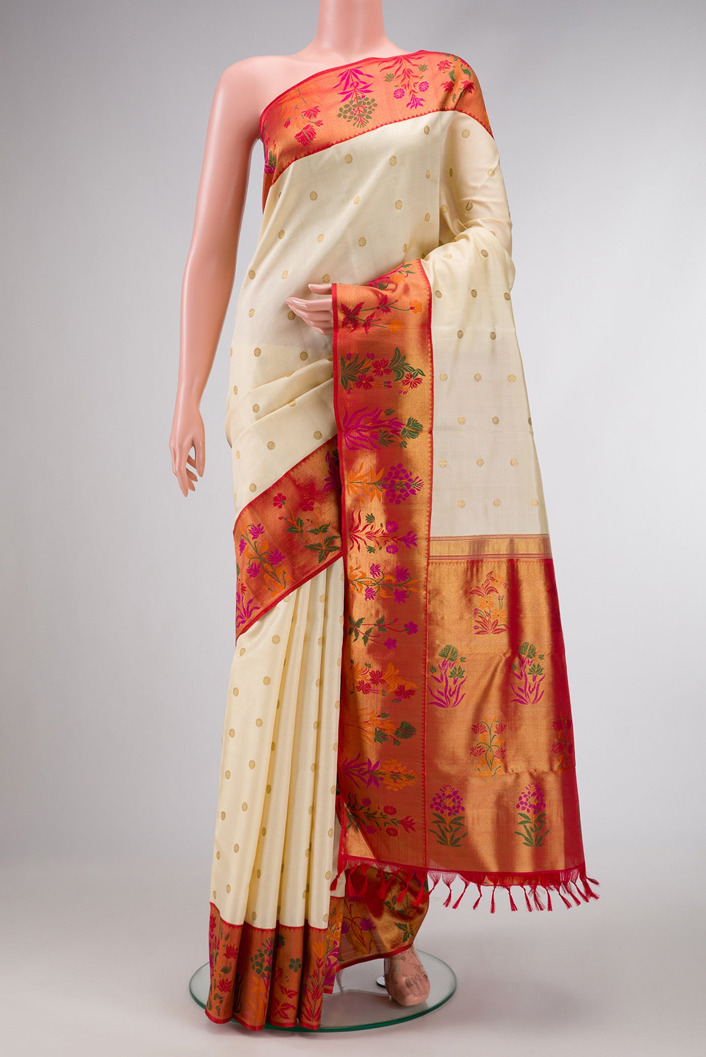 Pure Silk Pure Zari Off White Dual Tone Kanjivaram Saree with Zari Butta on the body and Fancy Border.  displayed on a mannequin