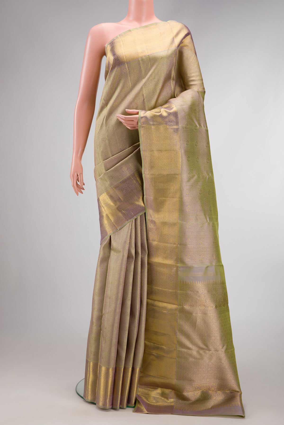 Pure Silk Pure Zari Light Green Dual Tone Kanjivaram Saree with Zari Brocade on the body and Zari Border.  displayed on a mannequin