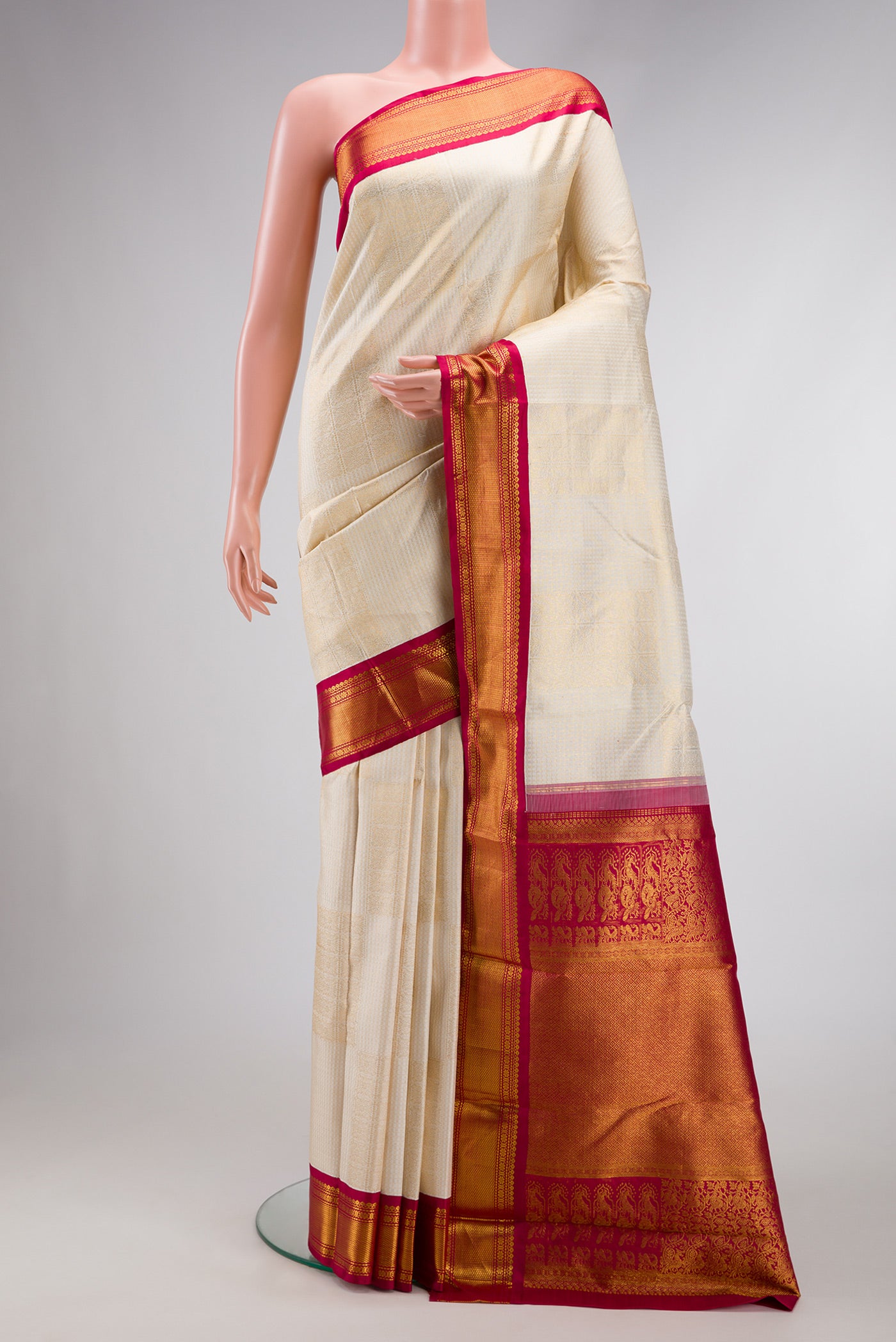 Off White Dual Tone Kanchipuram Silk Saree with Zari Brocade on the body and Zari Border.  displayed on a mannequin