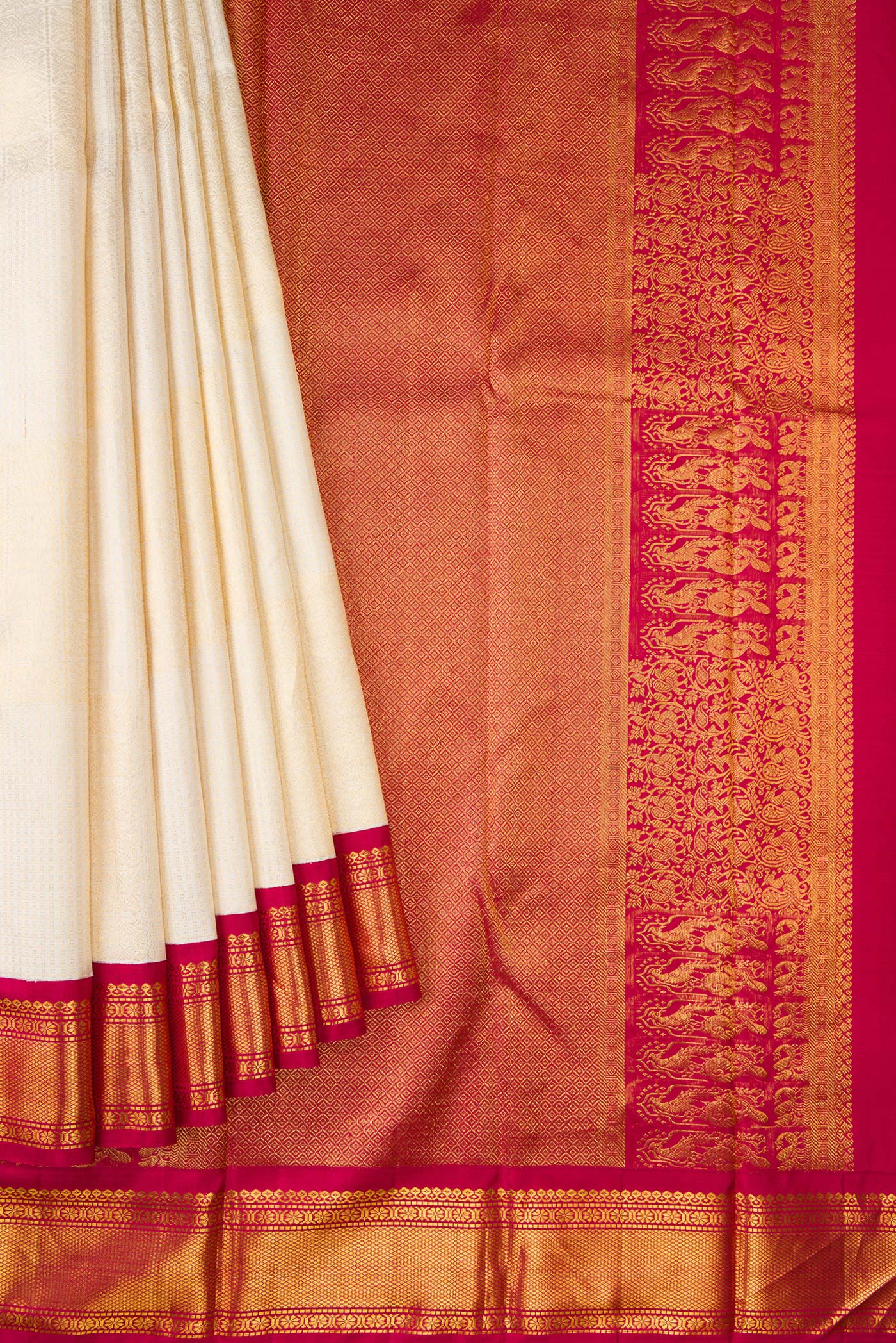 Pleats and pallu of Off White Dual Tone Kanchipuram Silk Saree with Zari Brocade on the body and Zari Border. 