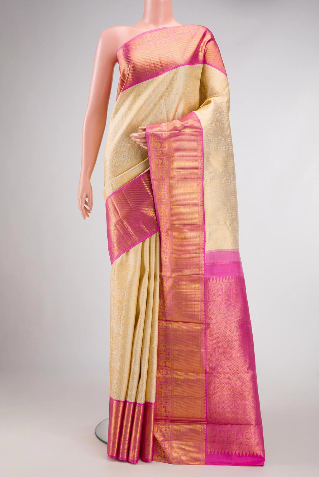 Off White Dual Tone Kanchipuram Silk Saree with Zari Brocade on the body and Zari Border.  displayed on a mannequin