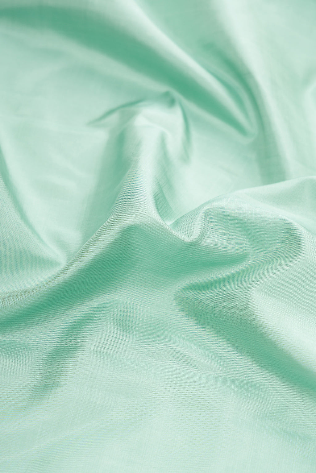 Close up of Pure Silk Pure Zari Blue Grey Dual Tone Kanchipuram Saree with Plain Body and Fancy Border.  displaying folds