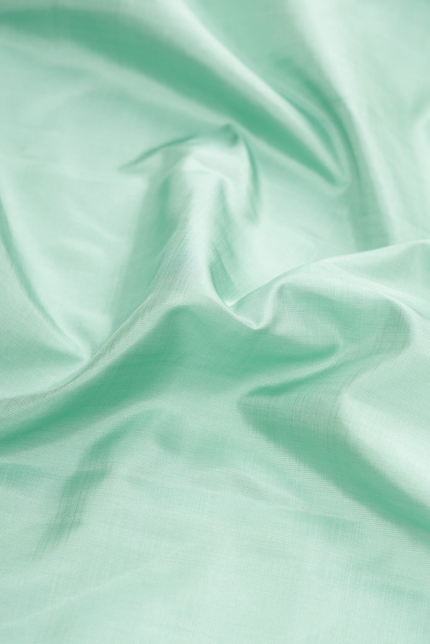 Close up of Pure Silk Pure Zari Blue Grey Dual Tone Kanchipuram Saree with Plain Body and Fancy Border.  displaying folds