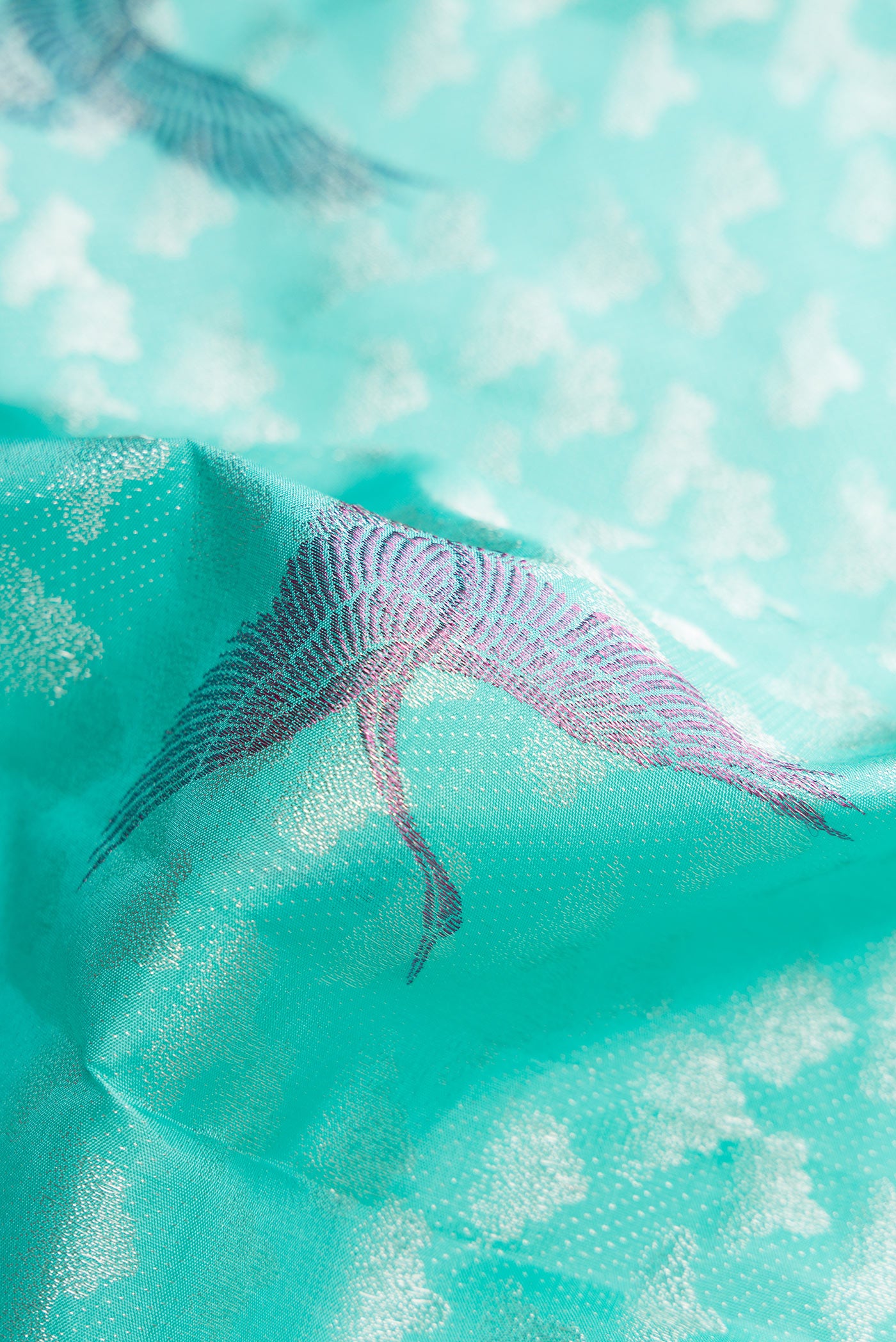 Close up of Sky Blue Dual Tone Kanchipuram Silk Saree with Zari Brocade on the body and Without Border.  displaying folds
