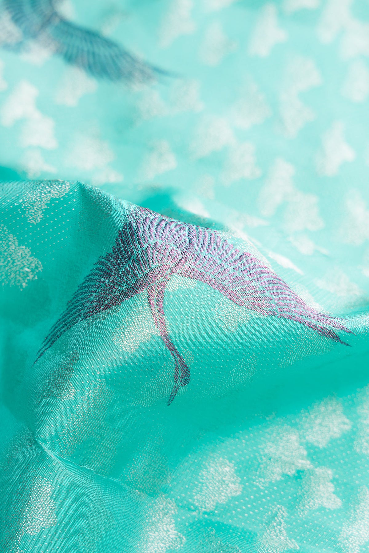 Close up of Sky Blue Dual Tone Kanchipuram Silk Saree with Zari Brocade on the body and Without Border.  displaying folds