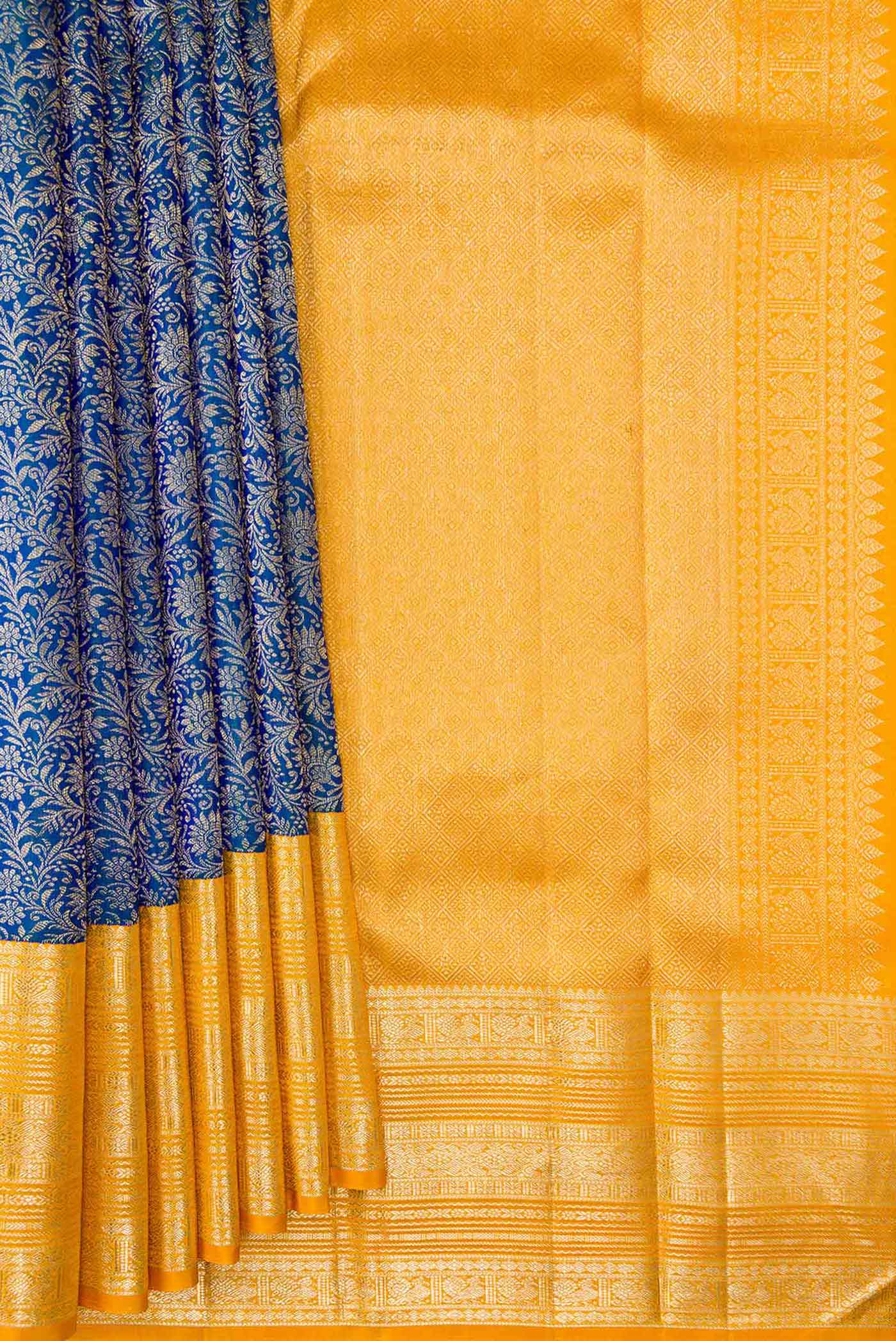 Pleats and pallu of Peacock Blue Dual Tone Kanchipuram Silk Saree with Zari Brocade on the body and Zari Border. 