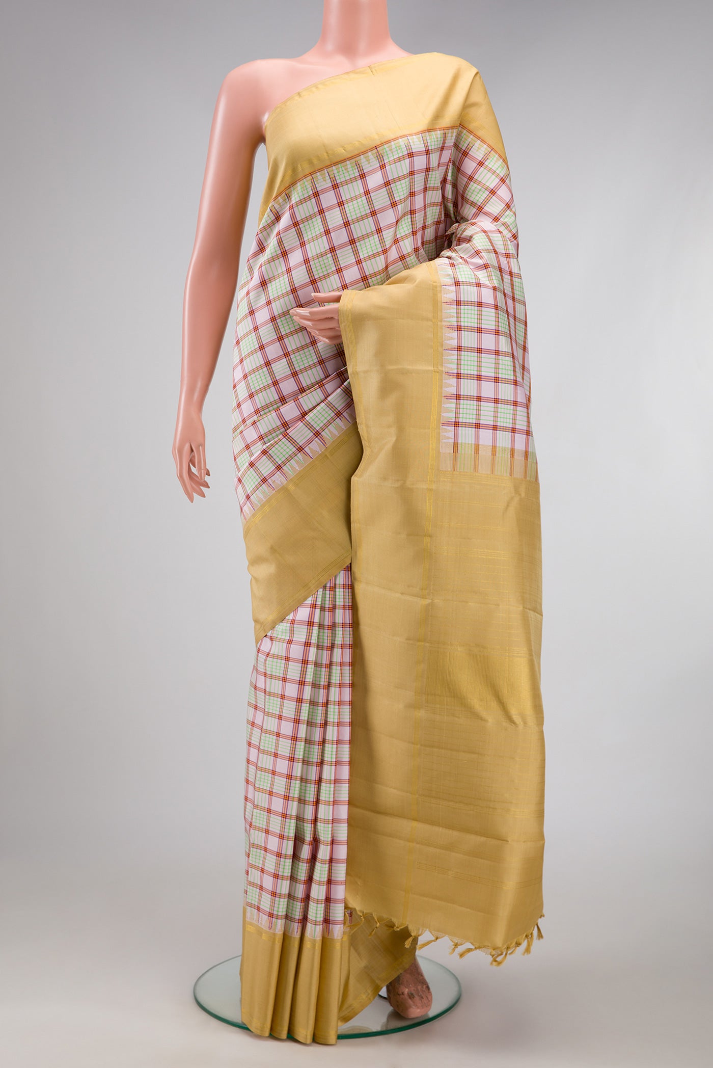 Pink Kanchipuram Silk Saree with Checked design on the body and Zari Border.  displayed on a mannequin
