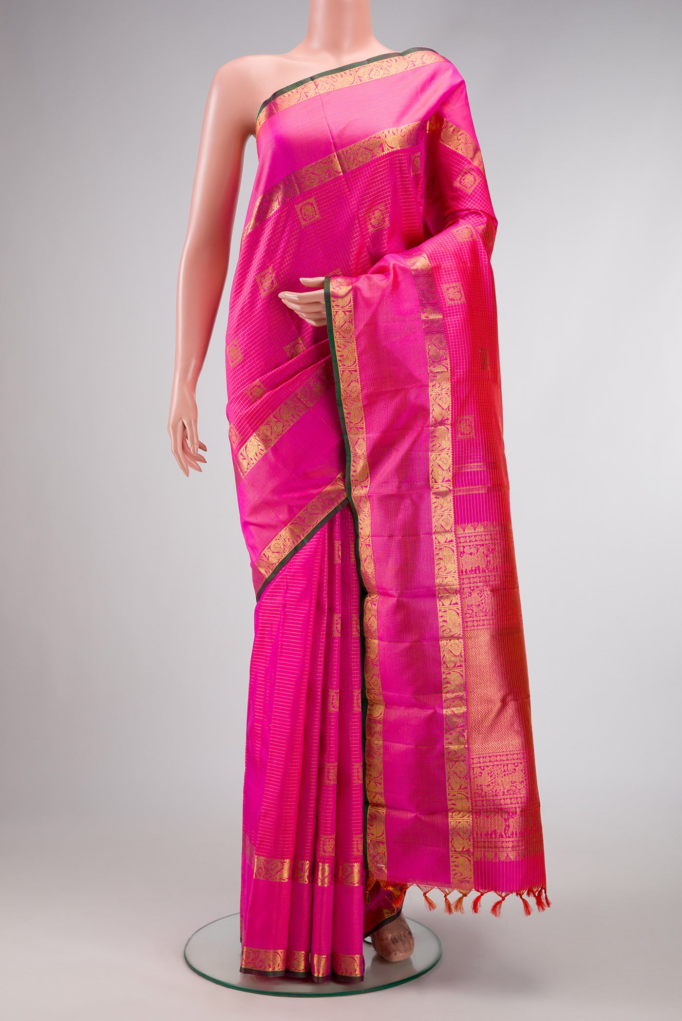 Pink Dual Tone Kanchipuram Silk Saree with Checked design on the body and Zari Border.  displayed on a mannequin