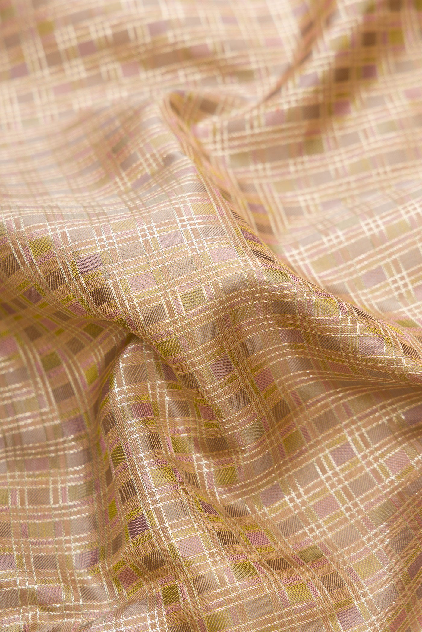 Close up of Gold Dual Tone Kanjivaram Silk Saree with Checked design on the body and Zari Border.  displaying folds