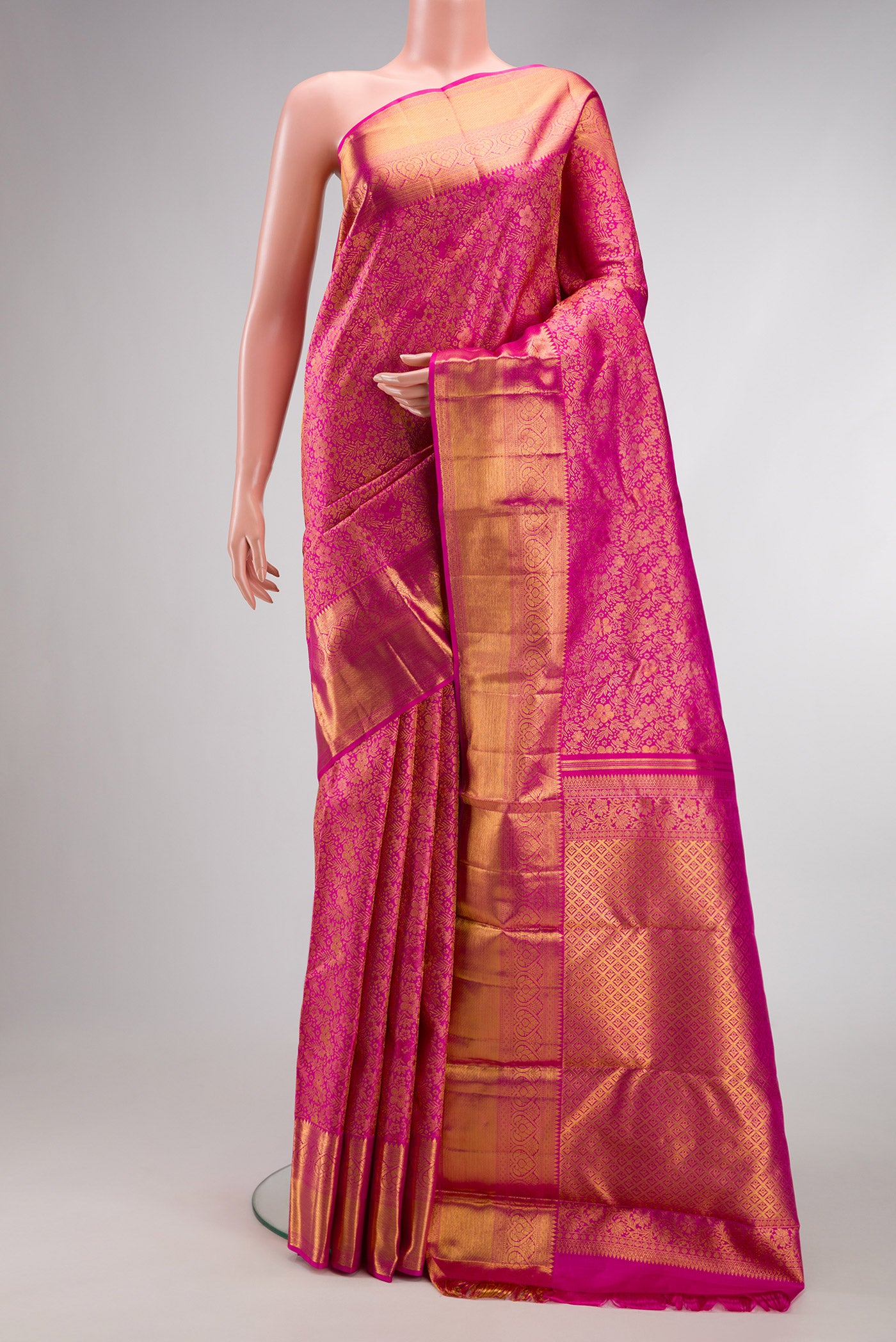 Pink Kanchipuram Silk Saree with Zari Brocade on the body and Zari Border.  displayed on a mannequin