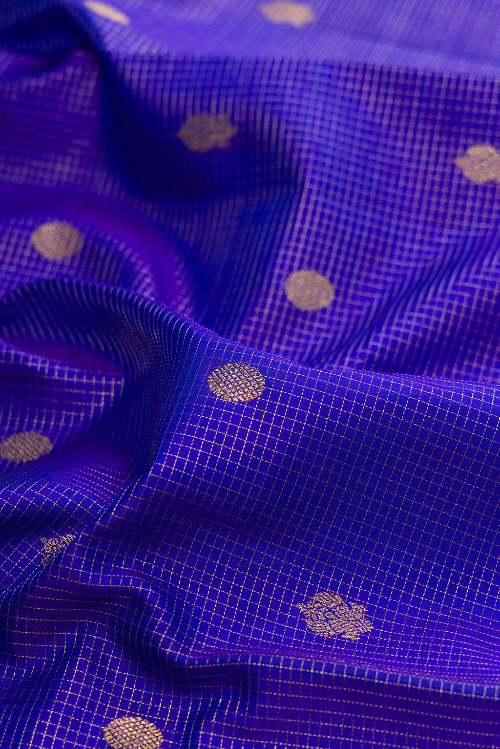 Close up of Pure Silk Pure Zari Royal Blue Kanjivaram Saree with Checked design on the body and Zari Border.  displaying folds