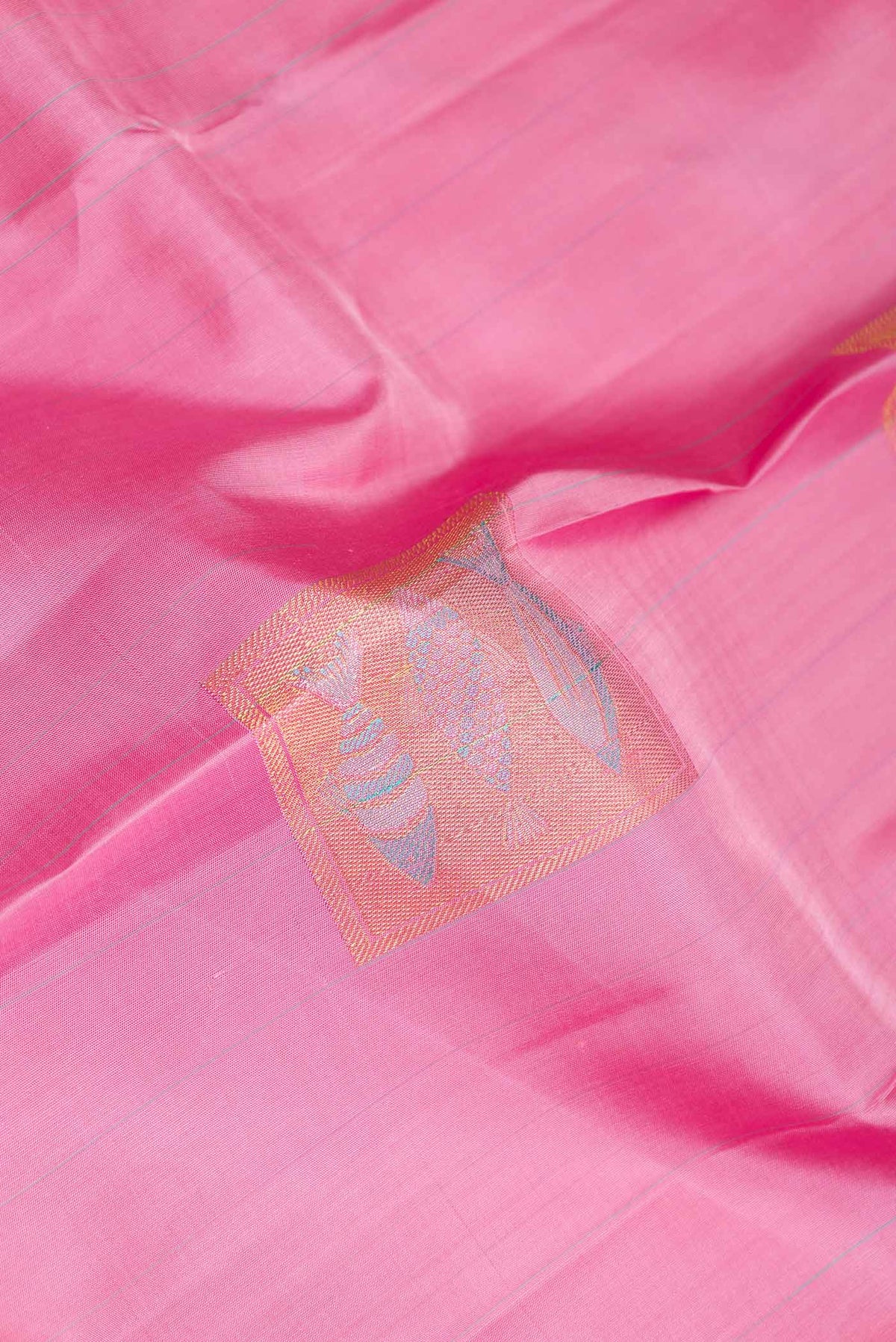 Close up of Pink Dual Tone Kanchipuram Silk Saree with Stripes on the body and Fancy Border displaying folds
