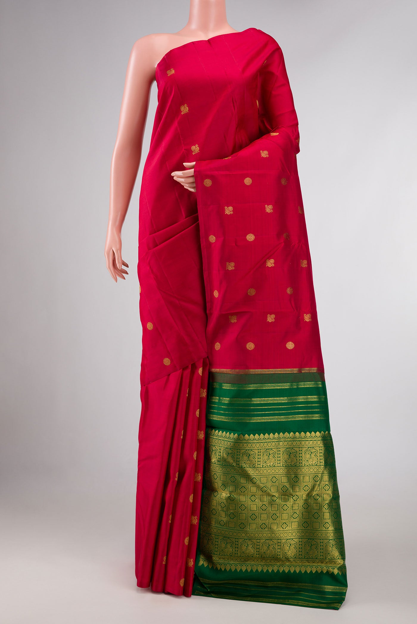 Maroon Dual Tone Kanchipuram Silk Saree with Zari Butta on the body and Without Border displayed on a mannequin