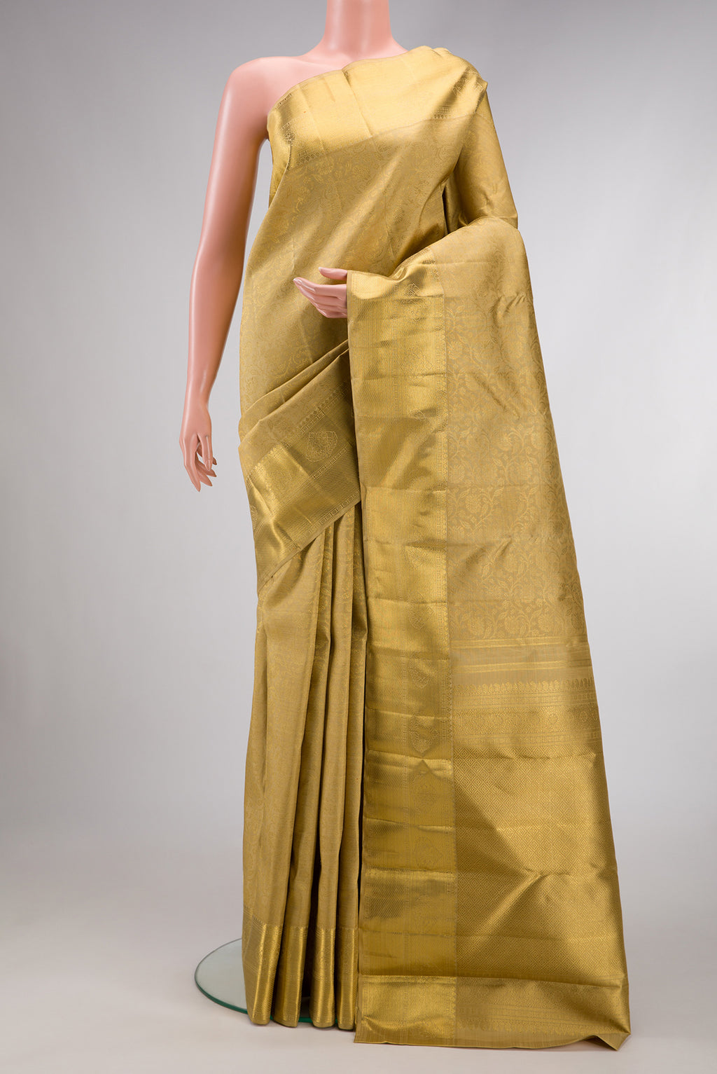 Pure Silk Pure Zari Gold Dual Tone Kanjivaram Saree with Zari Brocade on the body and Zari Border.  displayed on a mannequin