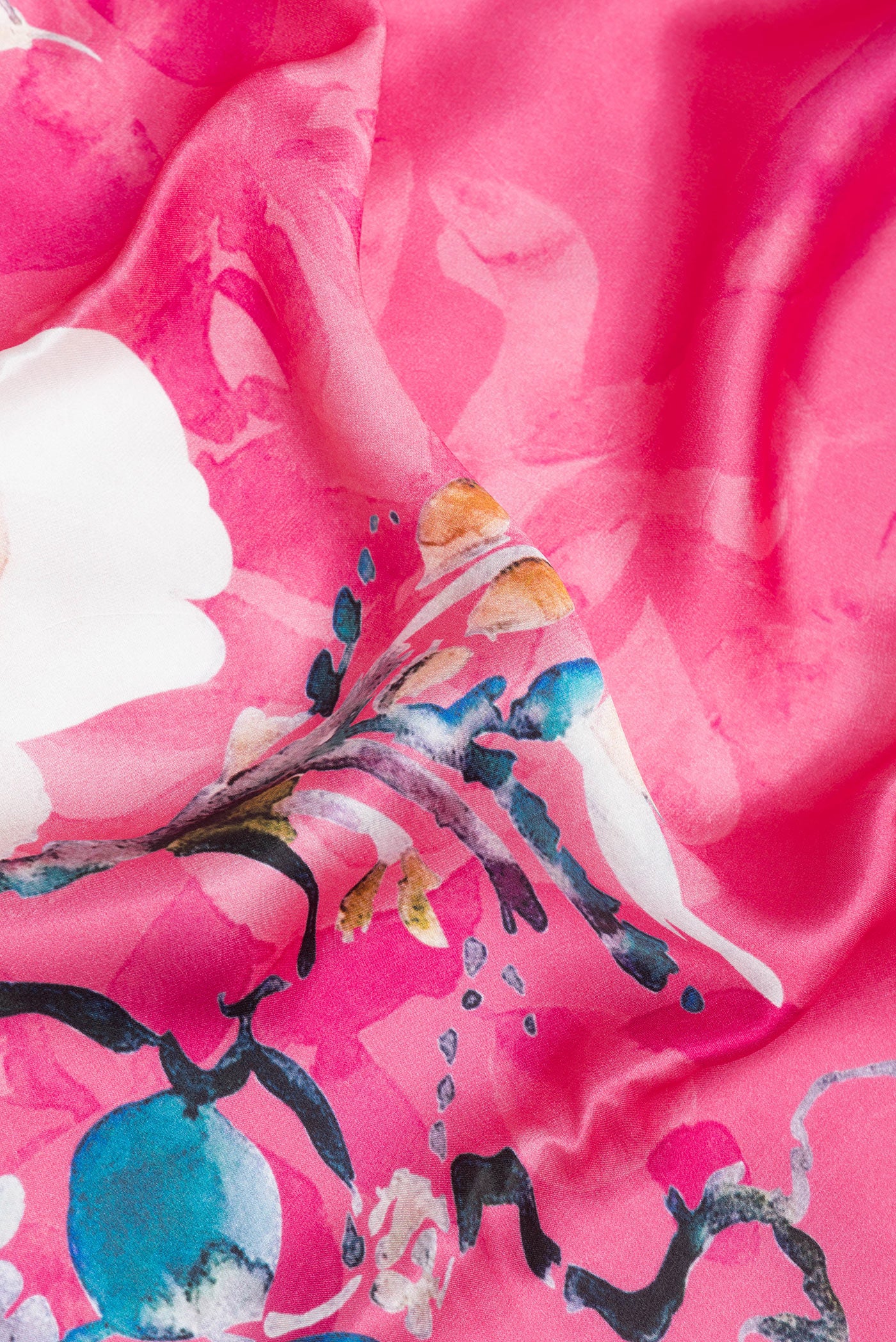 Close up of Pink Crepe Saree with Printed design on the body and Without Border.  displaying folds
