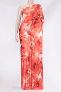 Orange Crepe Saree with Printed design on the body and Without Border.  displayed on a mannequin