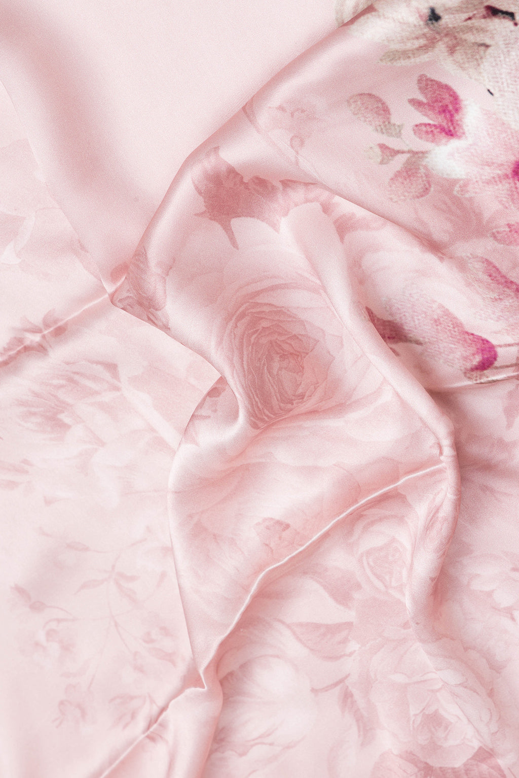 Close up of Rose Gold Dual Tone Mysore Crepe Saree with Printed design on the body and Without Border.  displaying folds