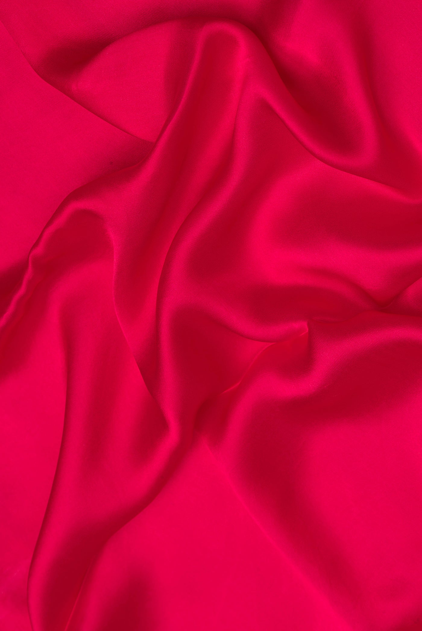 Close up of Pink Dual Tone Mysore Crepe Saree with Plain Body and Fancy Border.  displaying folds
