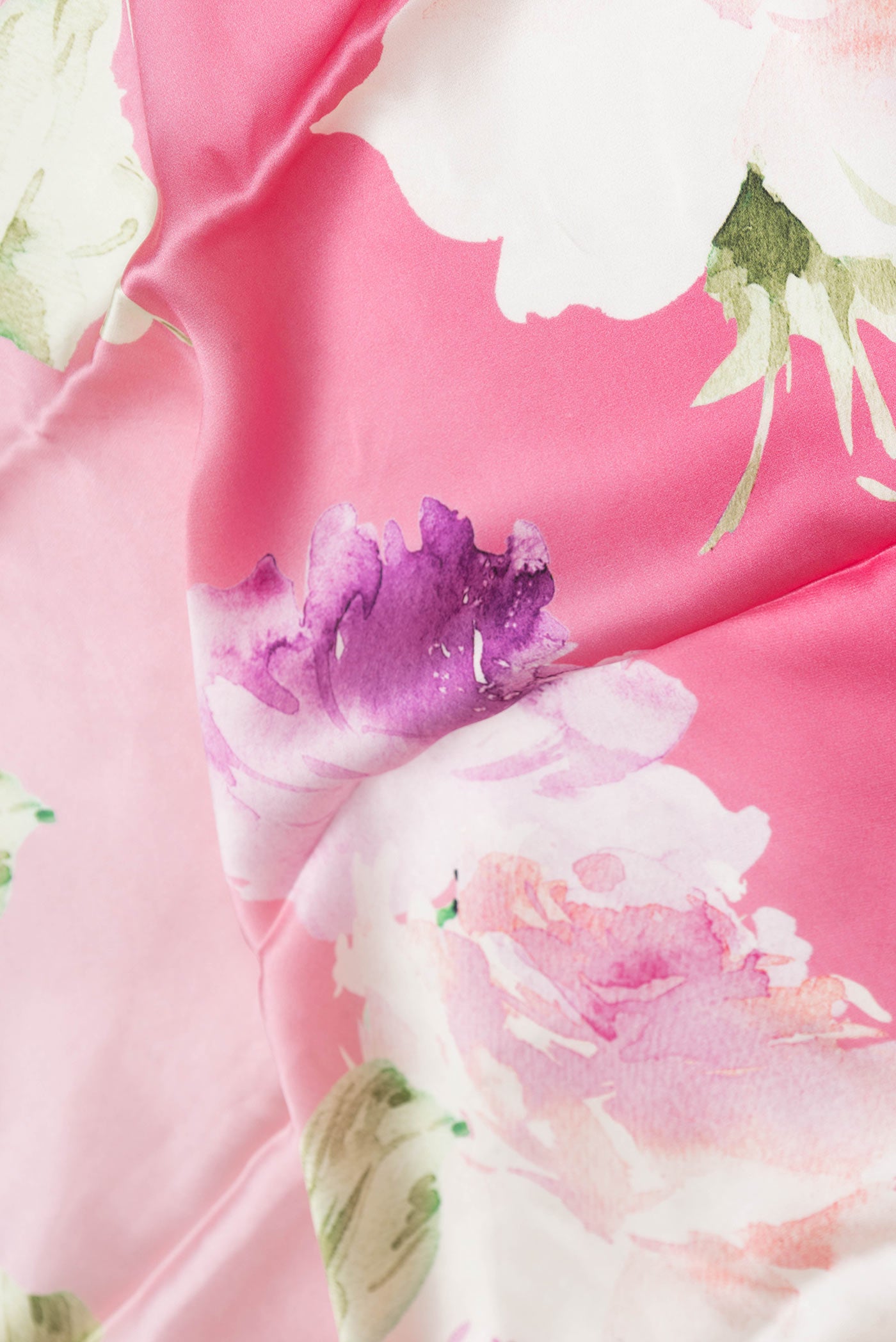Close up of Multi Color Satin Silk Saree with Ombre design on the body and Without Border displaying folds