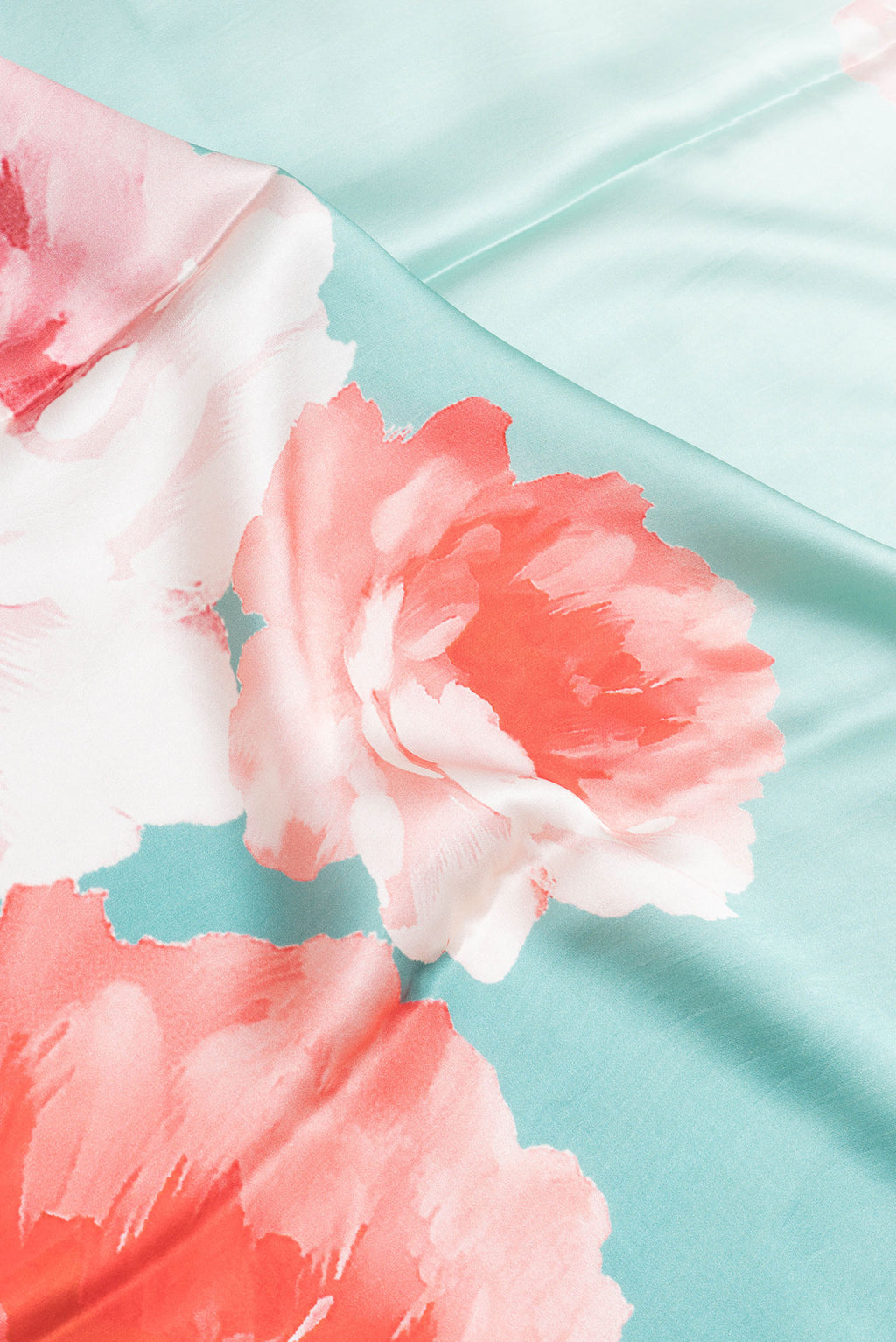 Close up of Sky Blue Dual Tone Mysore Crepe Saree with Printed design on the body and Without Border.  displaying folds