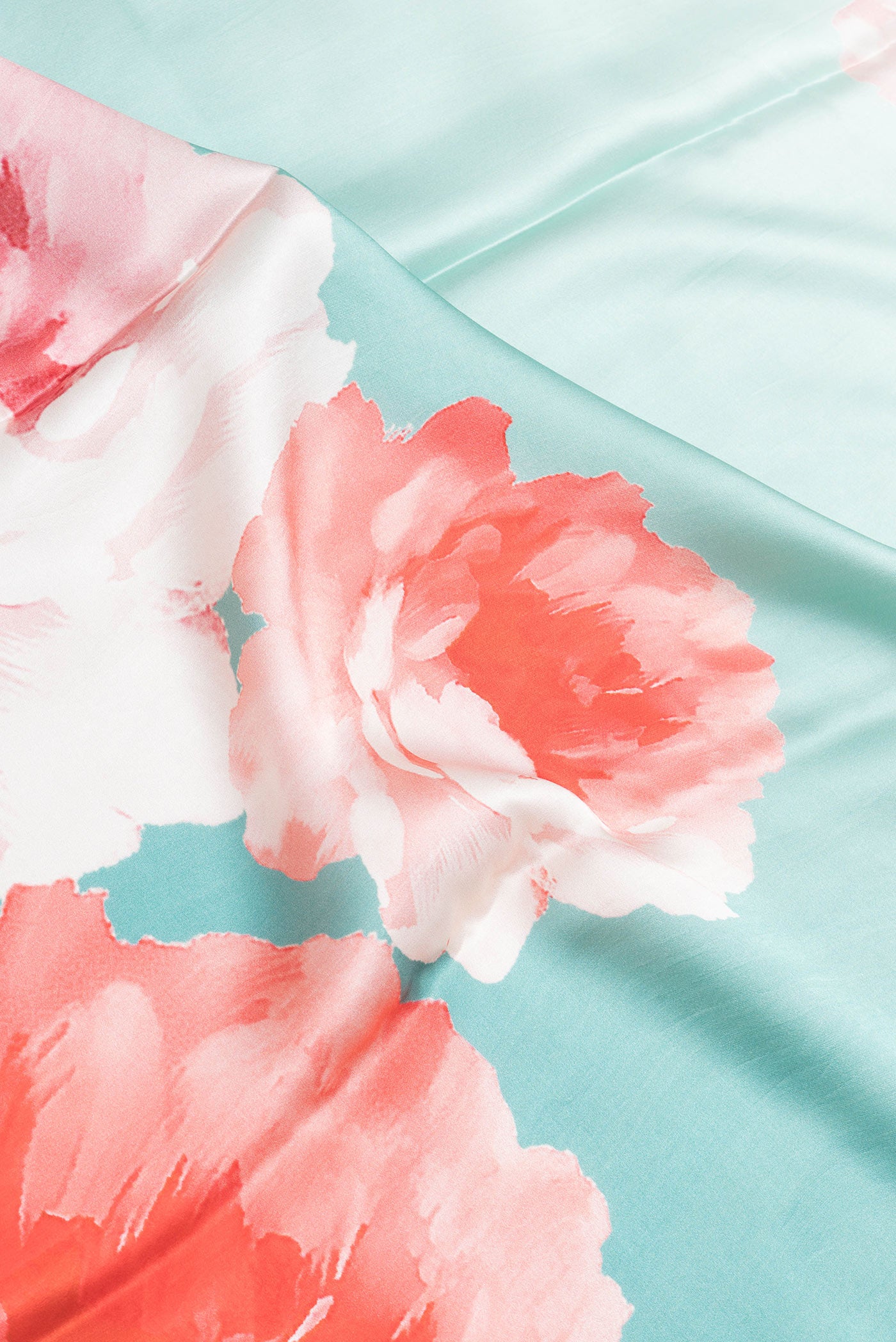 Close up of Sky Blue Dual Tone Mysore Crepe Saree with Printed design on the body and Without Border.  displaying folds