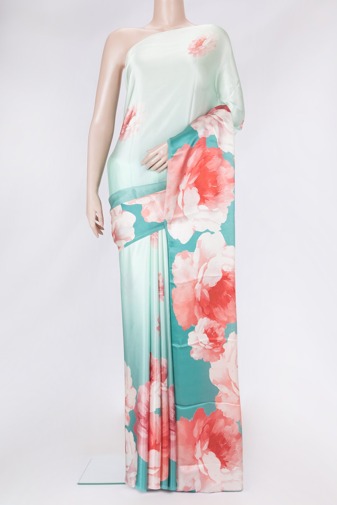 Sky Blue Dual Tone Mysore Crepe Saree with Printed design on the body and Without Border.  displayed on a mannequin