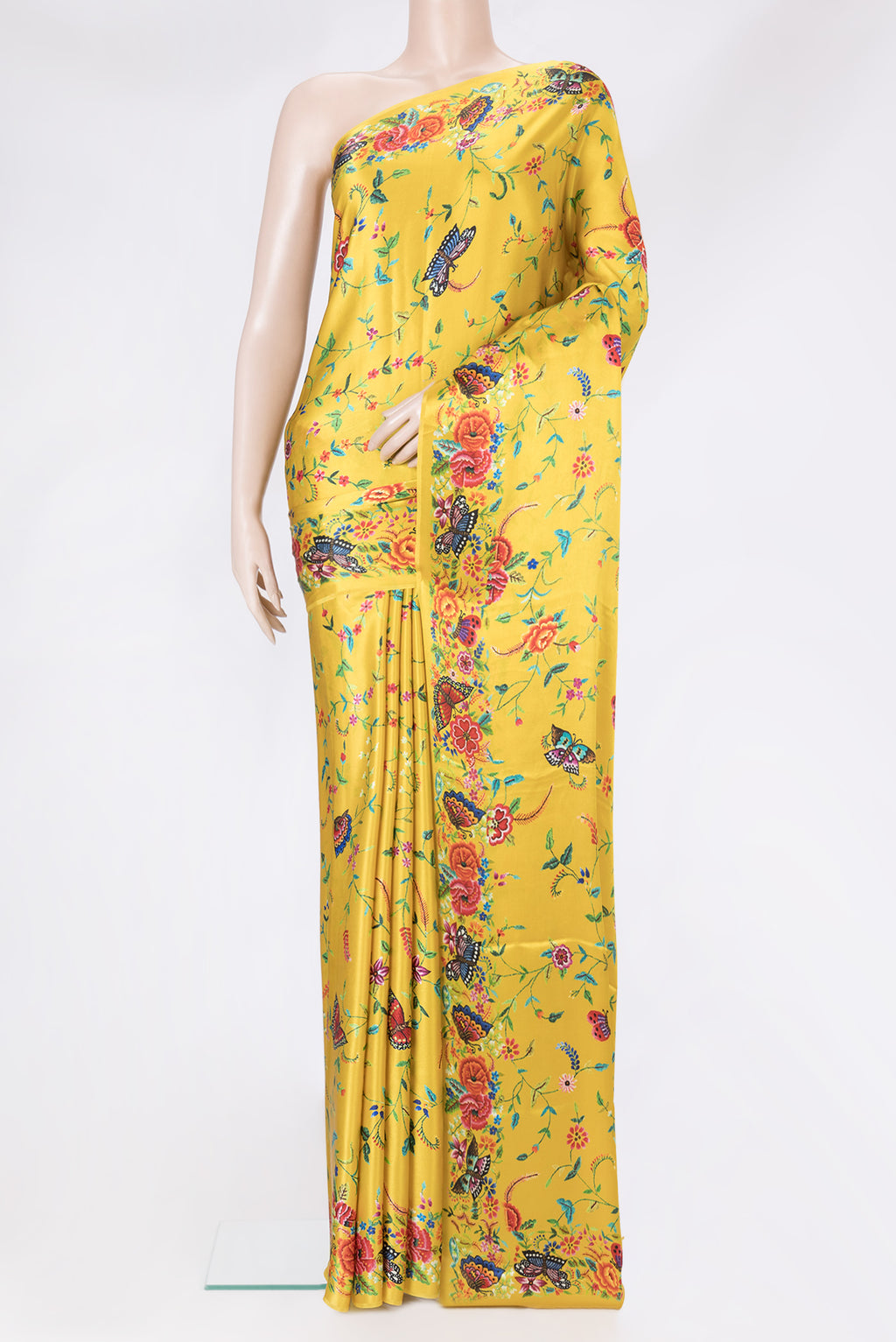 Yellow Dual Tone Crepe Saree with Printed design on the body and Printed Border.  displayed on a mannequin