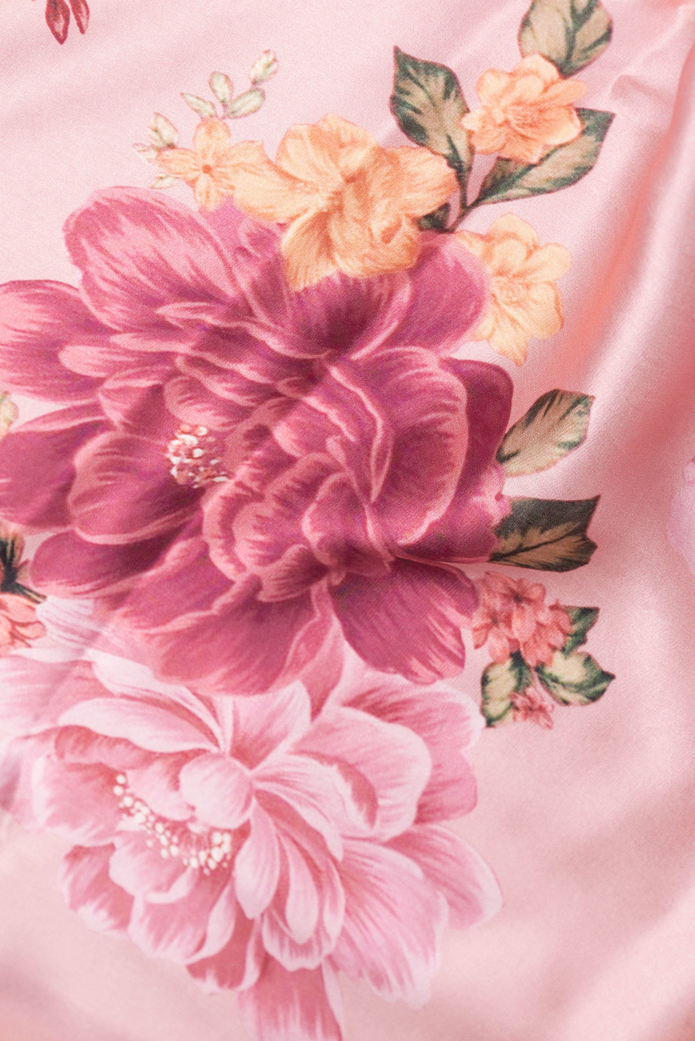 Close up of Rose Gold Dual Tone Crepe Saree with Printed design on the body and Without Border.  displaying folds