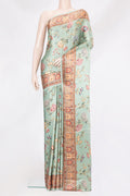 Pista Green Crepe Saree with Printed design on the body and Printed Border.  displayed on a mannequin