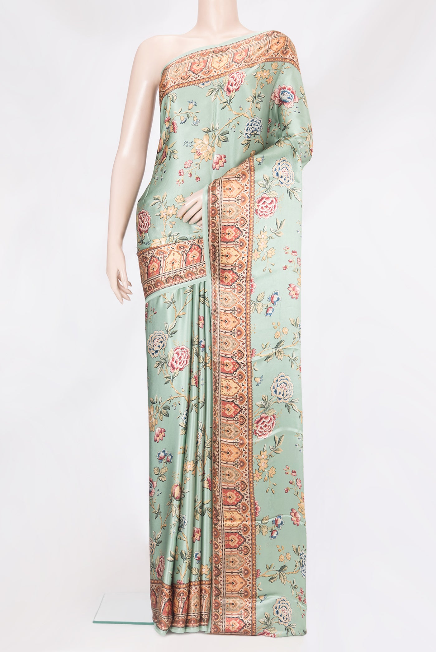 Pista Green Crepe Saree with Printed design on the body and Printed Border.  displayed on a mannequin