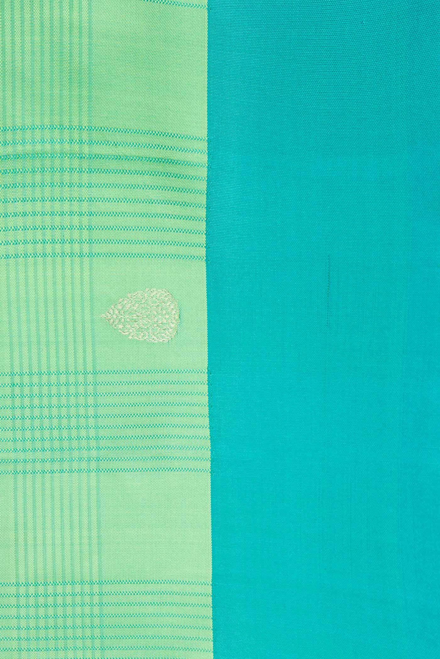 Border image of Pista Green Dual Tone Soft Silk Saree with Zari Butta on the body and Plain Border. 