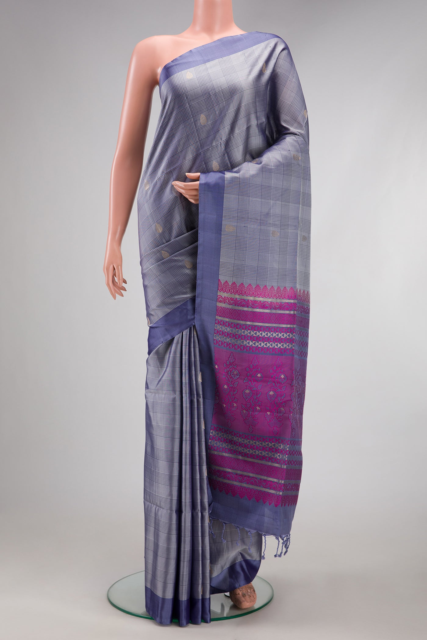 Grey Soft Silk Saree with Checked design on the body and Plain Border.  displayed on a mannequin