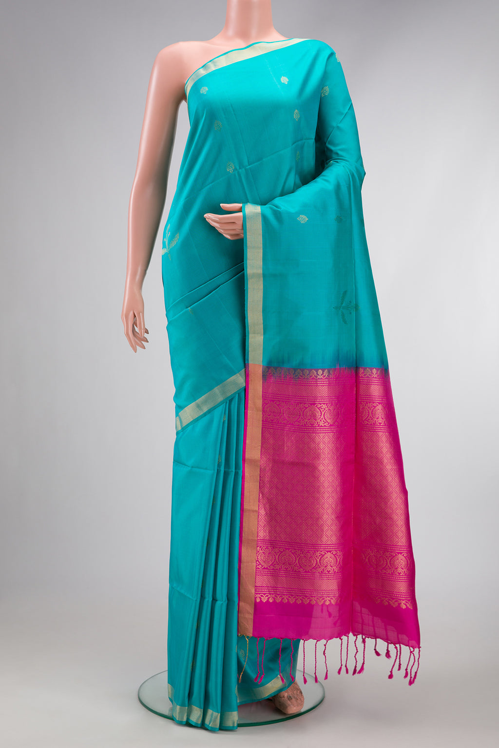Sky Blue Dual Tone Soft Silk Saree with Zari Butta on the body and Zari Border.  displayed on a mannequin