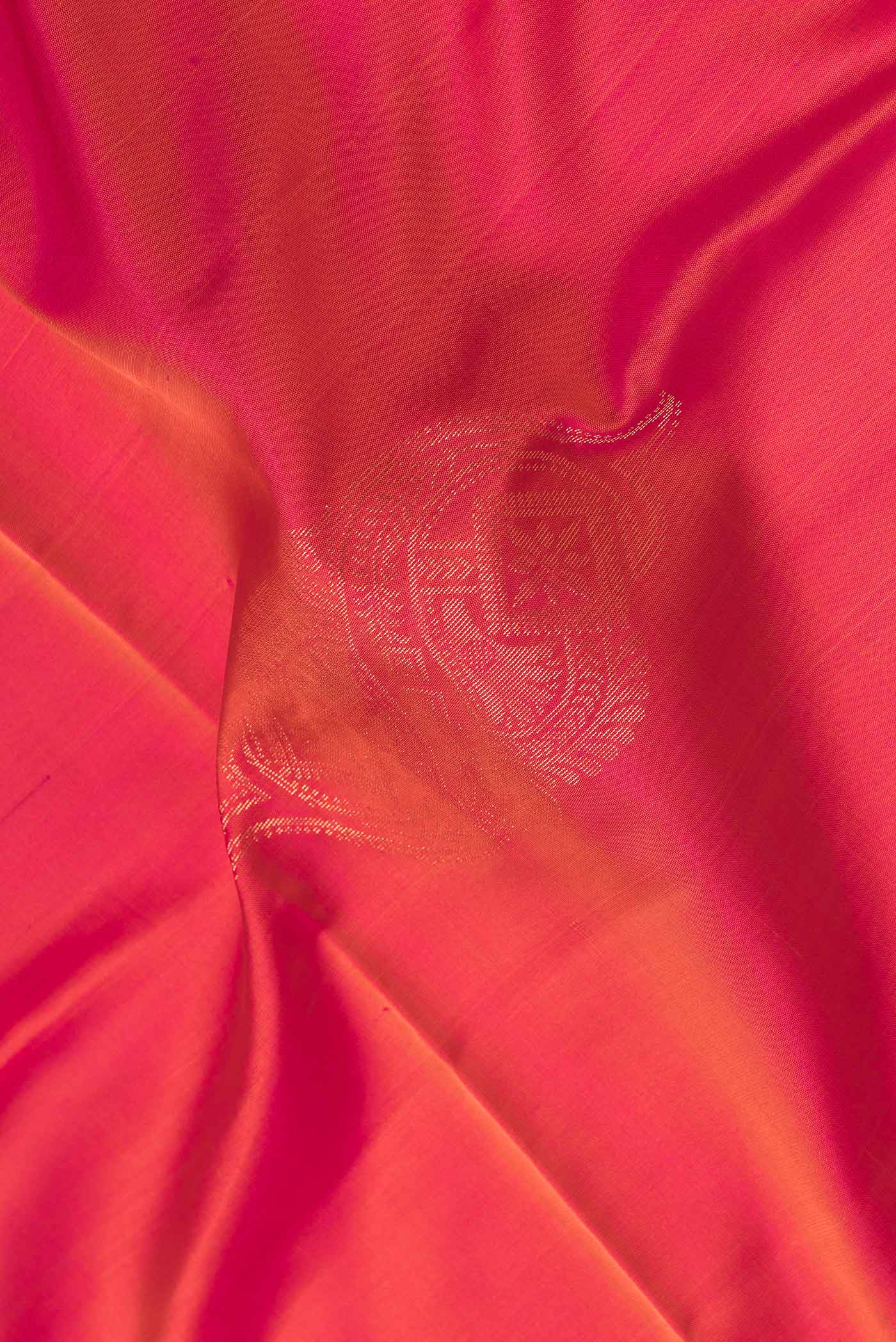 Close up of Pink Dual Tone Soft Silk Saree with Zari Butta on the body and Zari Border.  displaying folds