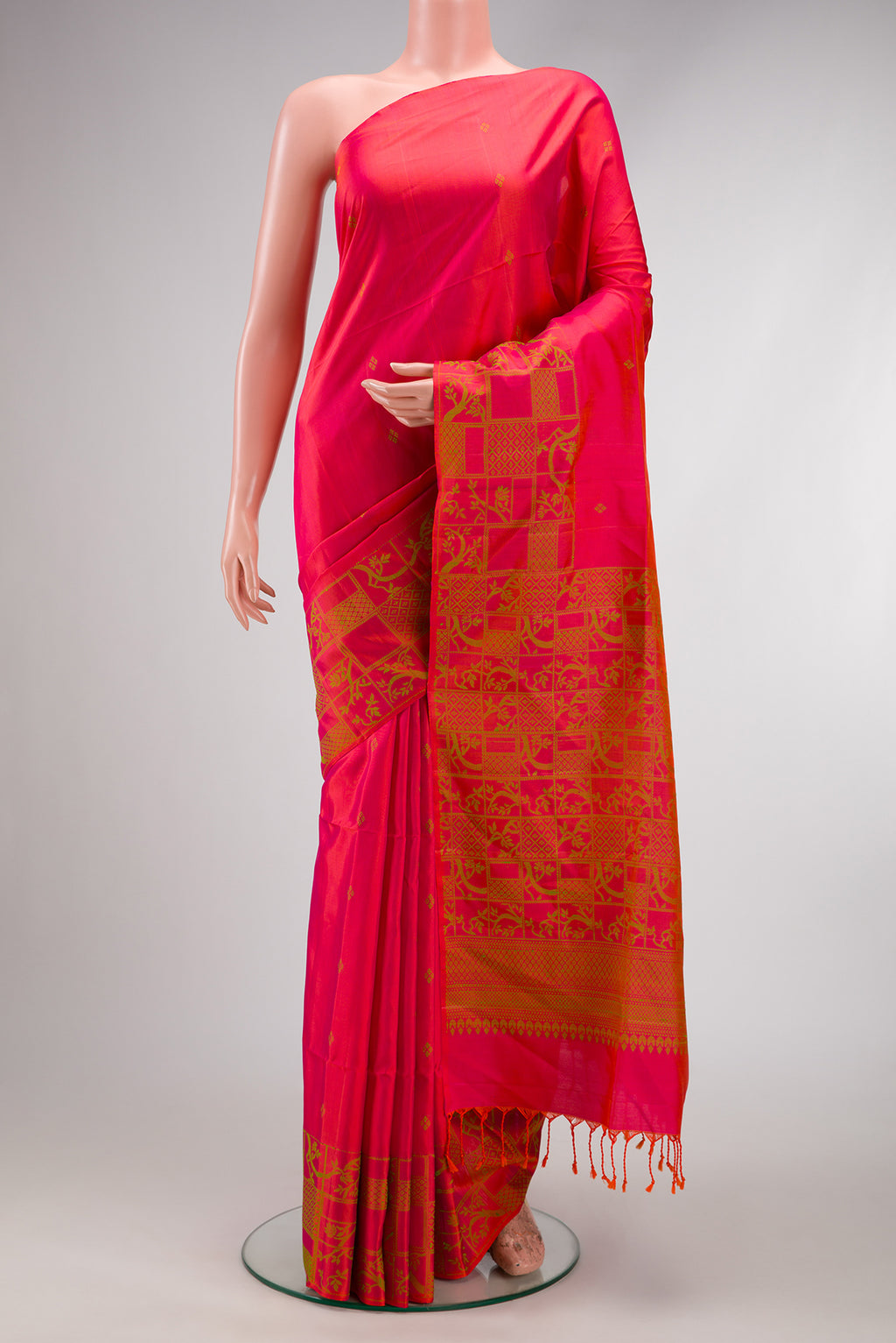 Coral Dual Tone Soft Silk Saree with Thread Butta on the body and Fancy Border.  displayed on a mannequin