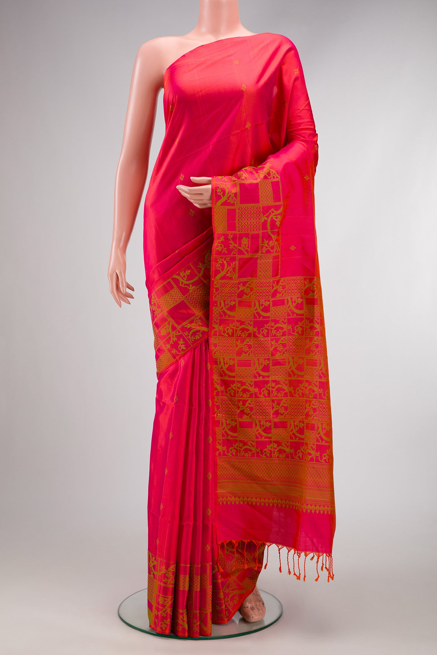 Coral Dual Tone Soft Silk Saree with Thread Butta on the body and Fancy Border.  displayed on a mannequin