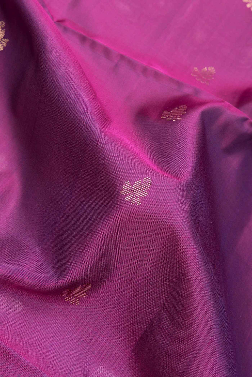 Close up of Purple Dual Tone Soft Silk Saree with Zari Butta on the body and Fancy Border.  displaying folds