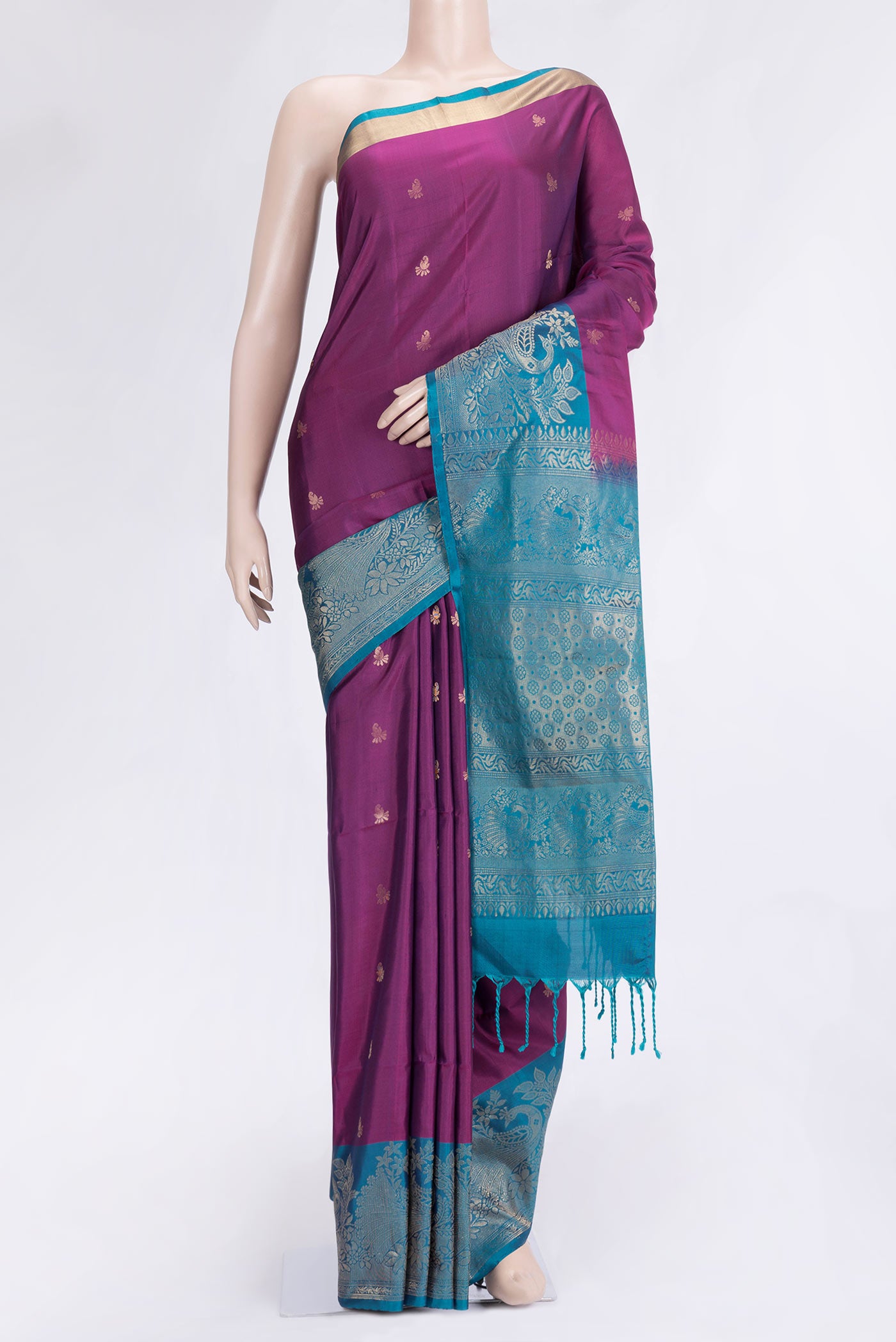 Purple Dual Tone Soft Silk Saree with Zari Butta on the body and Fancy Border.  displayed on a mannequin