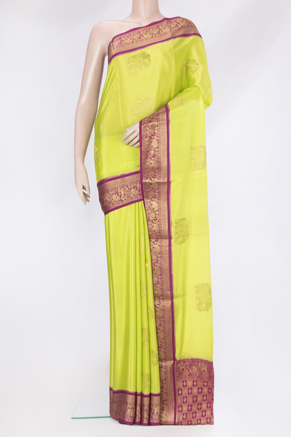 Parrot Green Mysore Silk Saree with Zari Butta on the body and Zari Border.  displayed on a mannequin