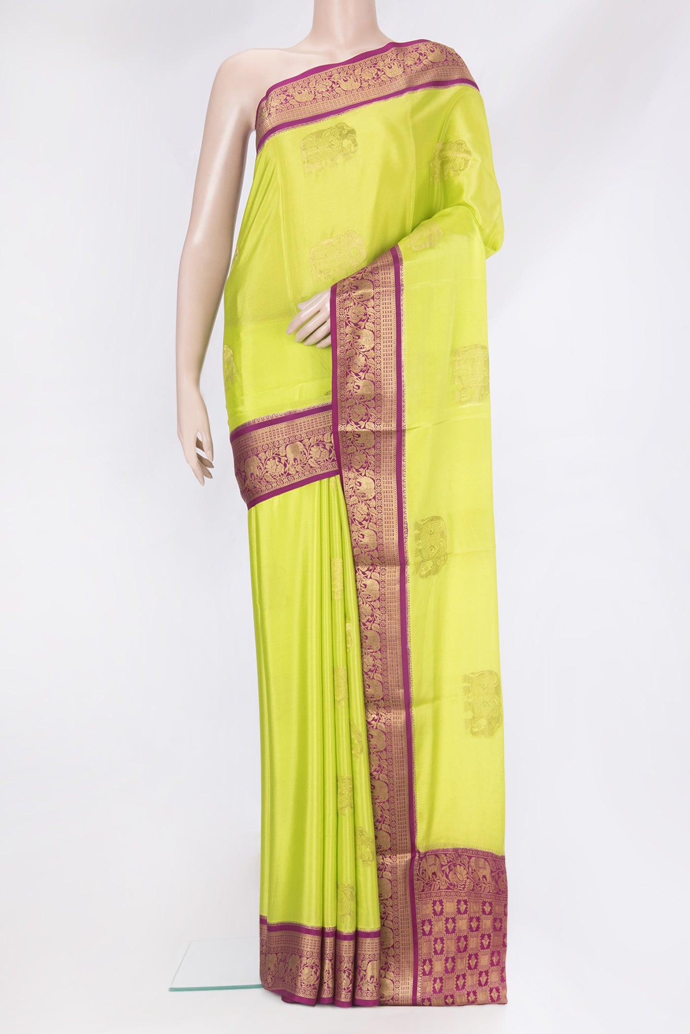 Parrot Green Mysore Silk Saree with Zari Butta on the body and Zari Border.  displayed on a mannequin