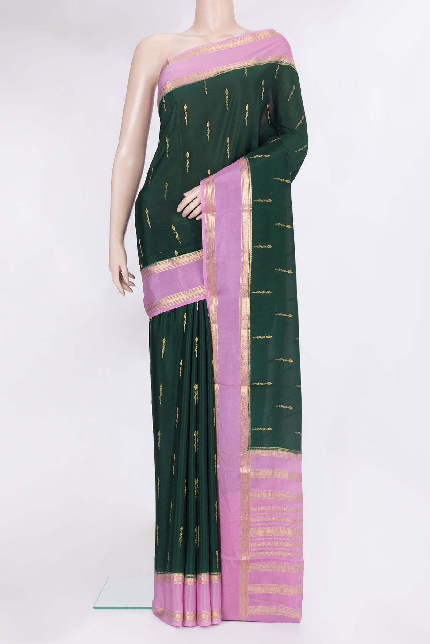 Bottle Green Mysore Silk Saree with Zari Butta on the body and Zari Border.  displayed on a mannequin