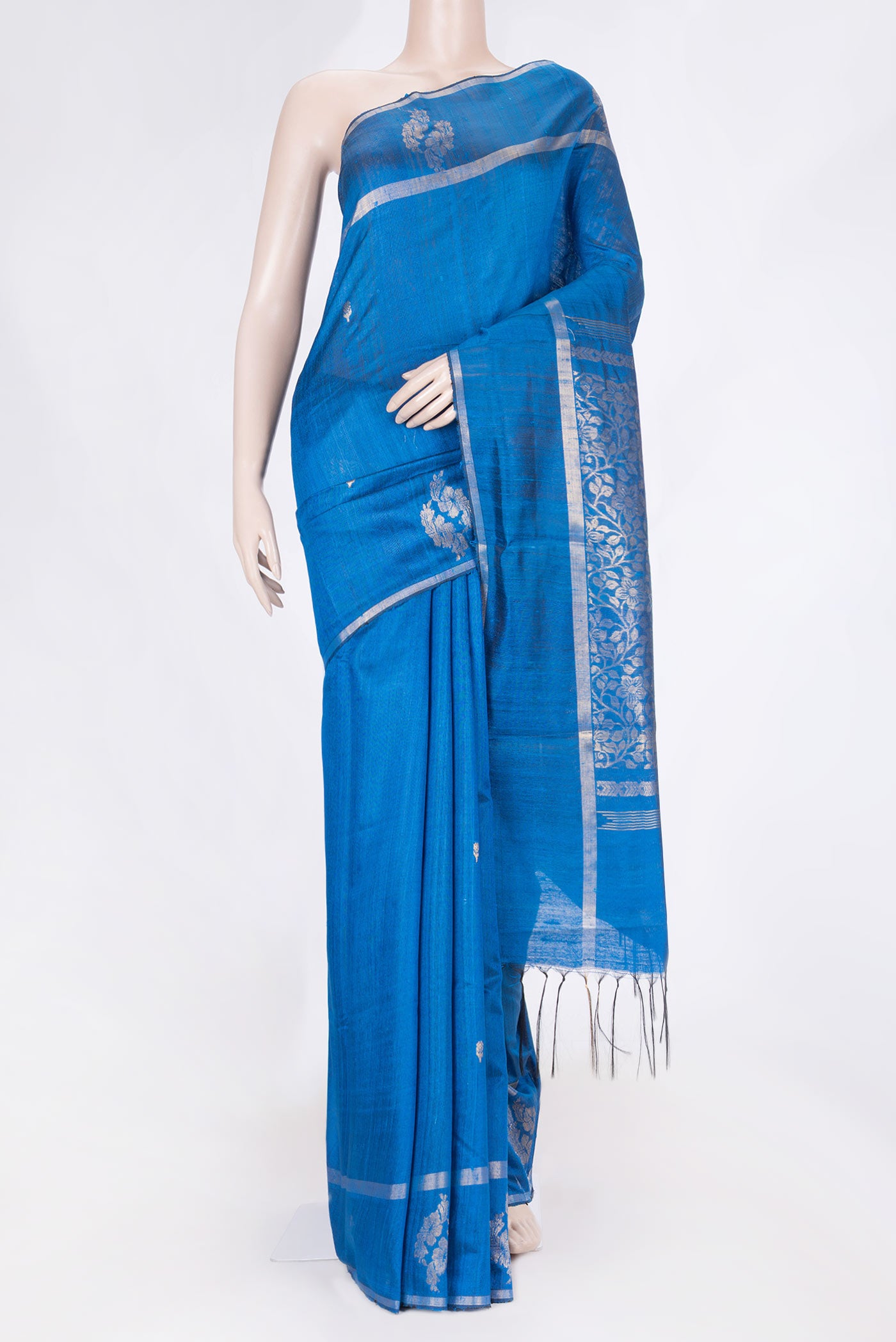 Peacock Blue Dual Tone Tussar Saree with Zari Butta on the body and Fancy Border displayed on a mannequin