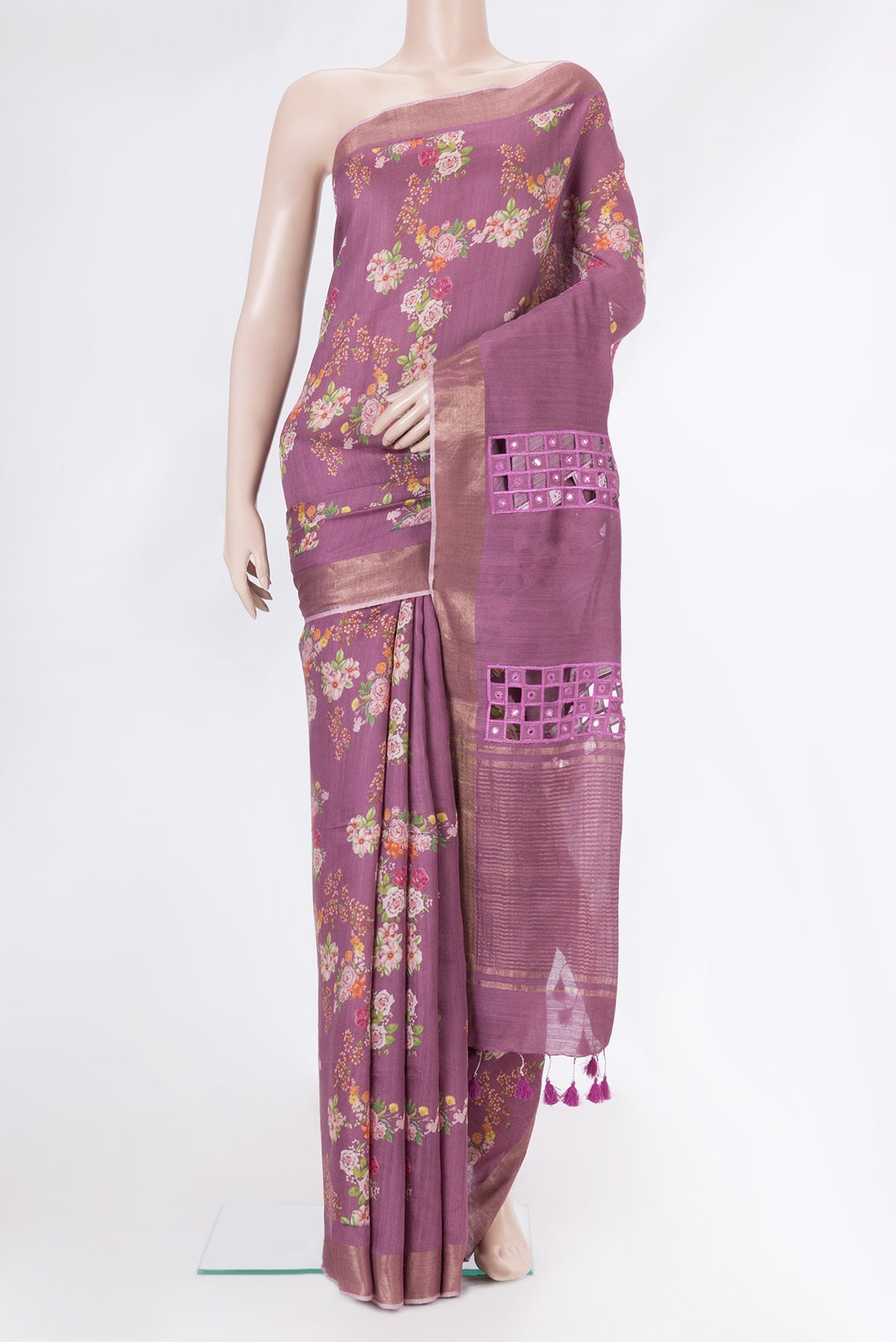 Purple Tussar Silk Saree with Floral Print on the body and Zari Border.  displayed on a mannequin