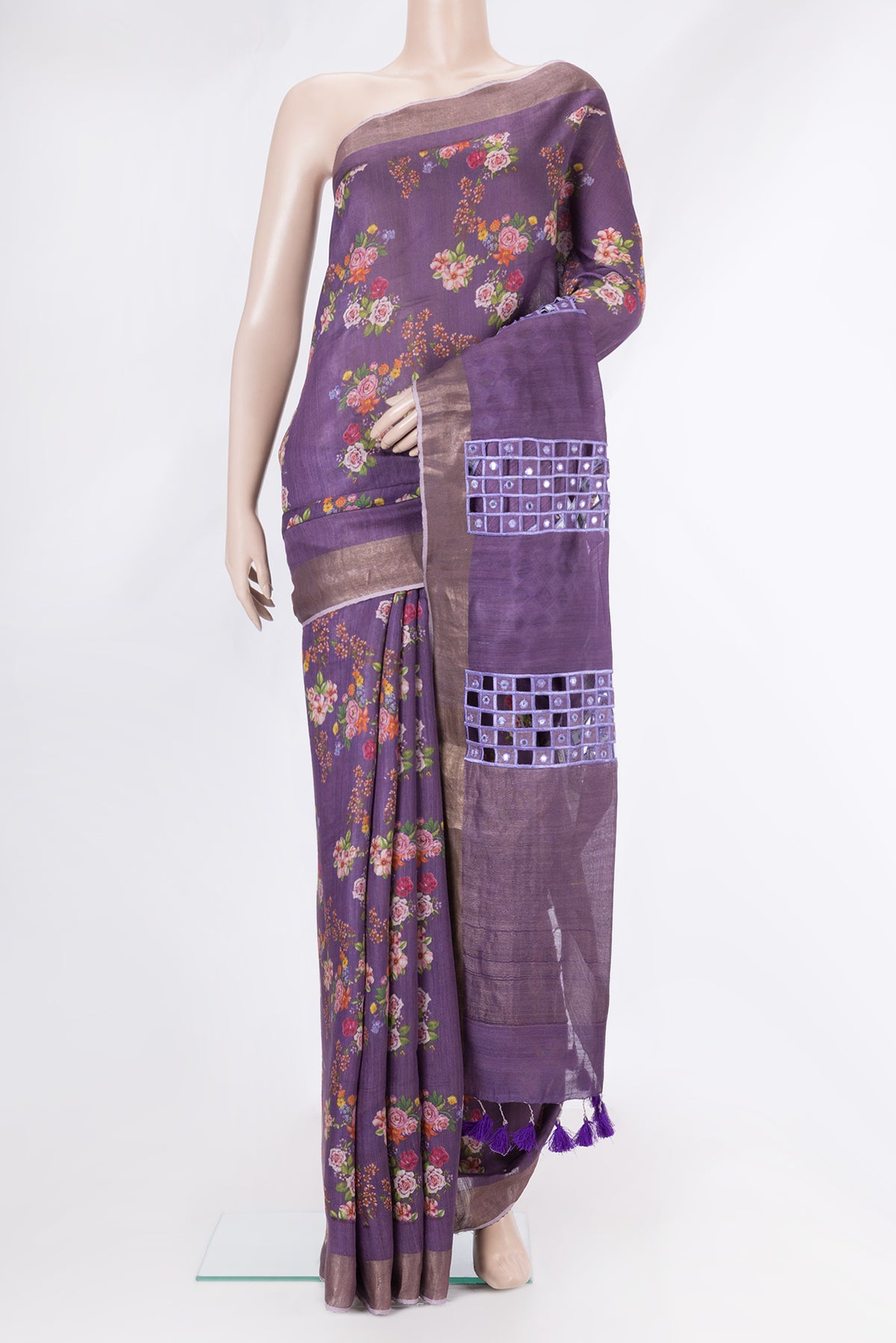Purple Tussar Silk Saree with Floral Print on the body and Zari Border.  displayed on a mannequin