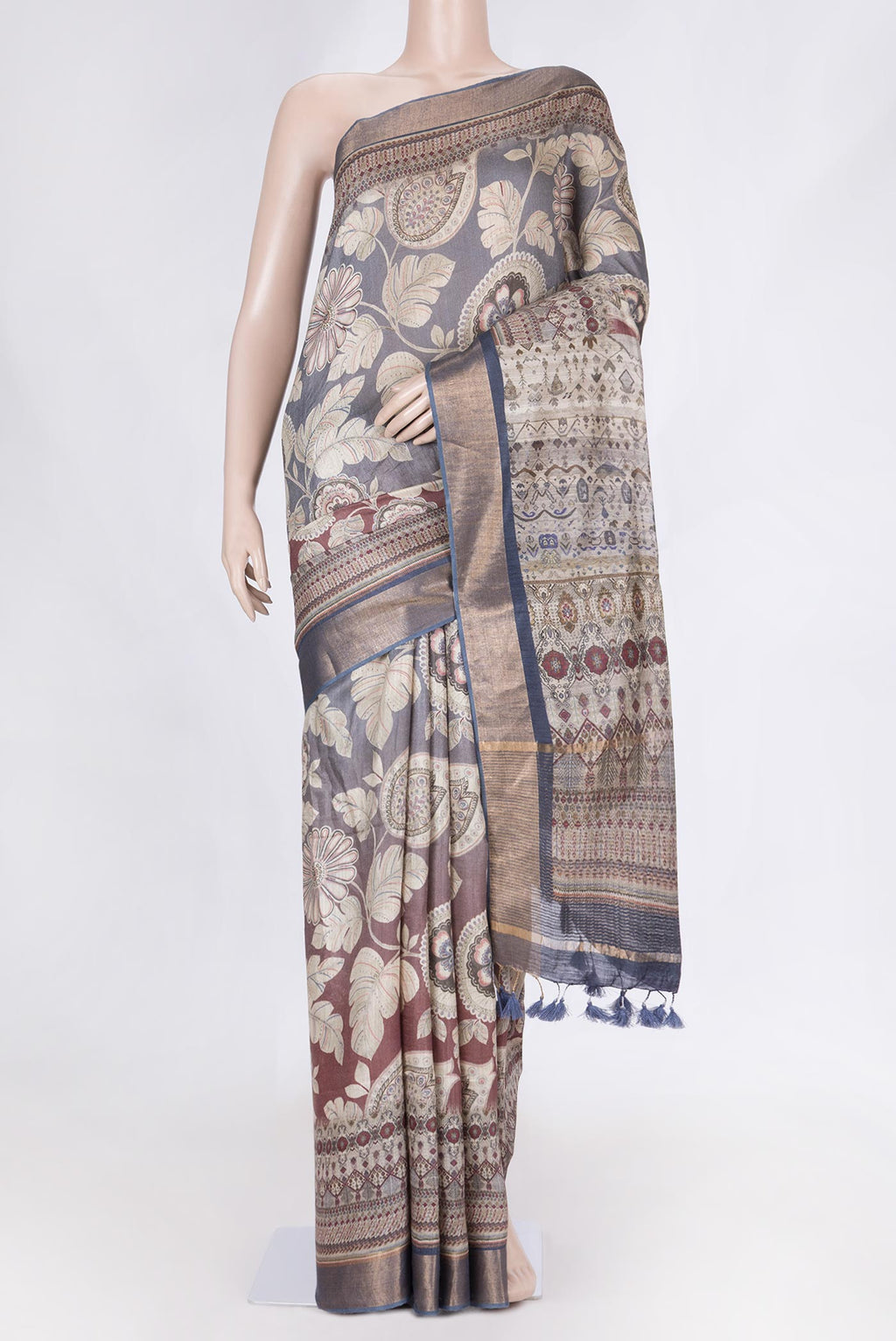 Maroon Dual Tone Tussar Saree with Printed design on the body and Zari Border displayed on a mannequin