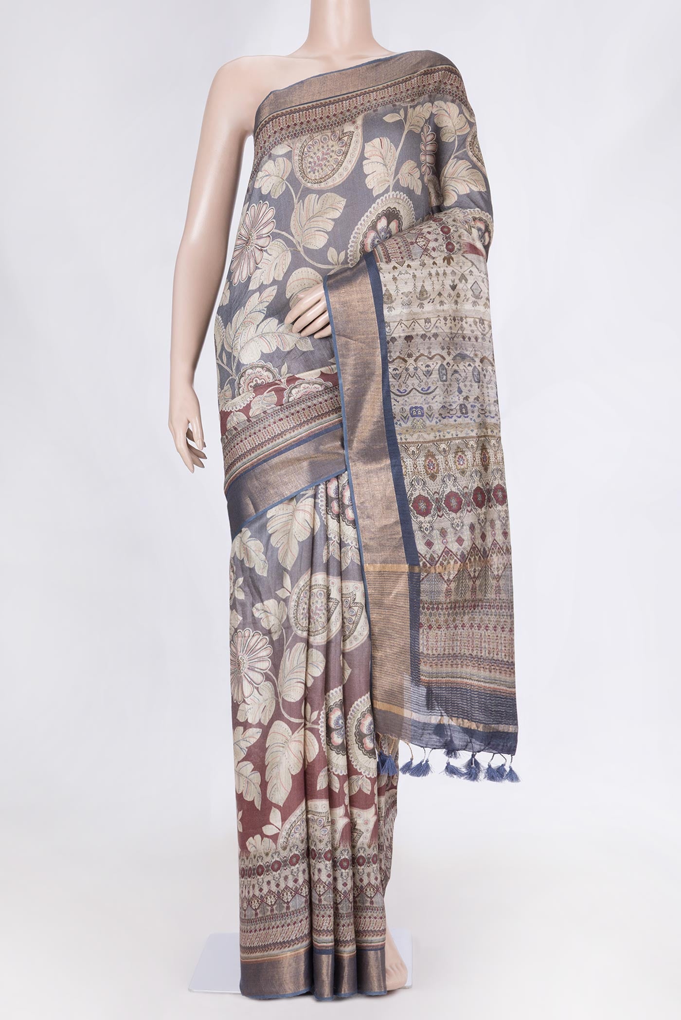 Maroon Dual Tone Tussar Saree with Printed design on the body and Zari Border displayed on a mannequin