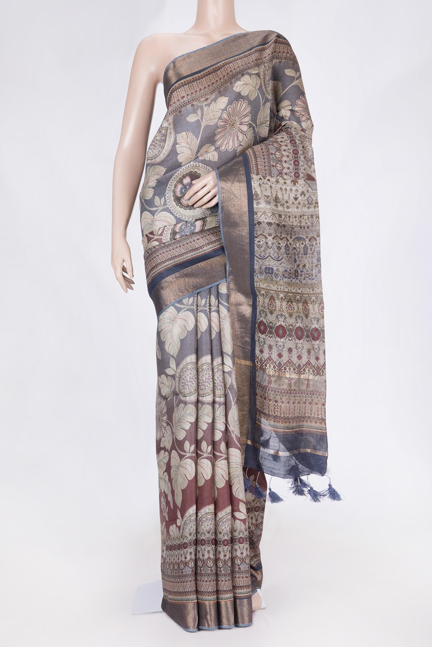Maroon Dual Tone Tussar Saree with Printed design on the body and Zari Border displayed on a mannequin