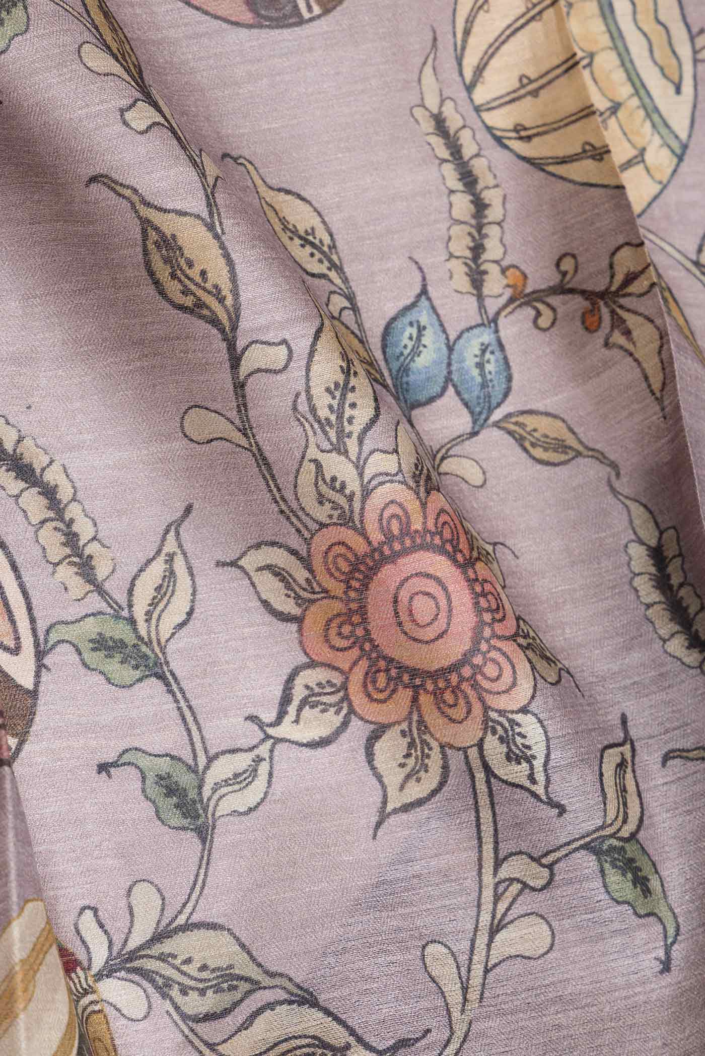 Close up of Purple Dual Tone Tussar Saree with kalamkari Print on the body and Fancy Border.  displaying folds