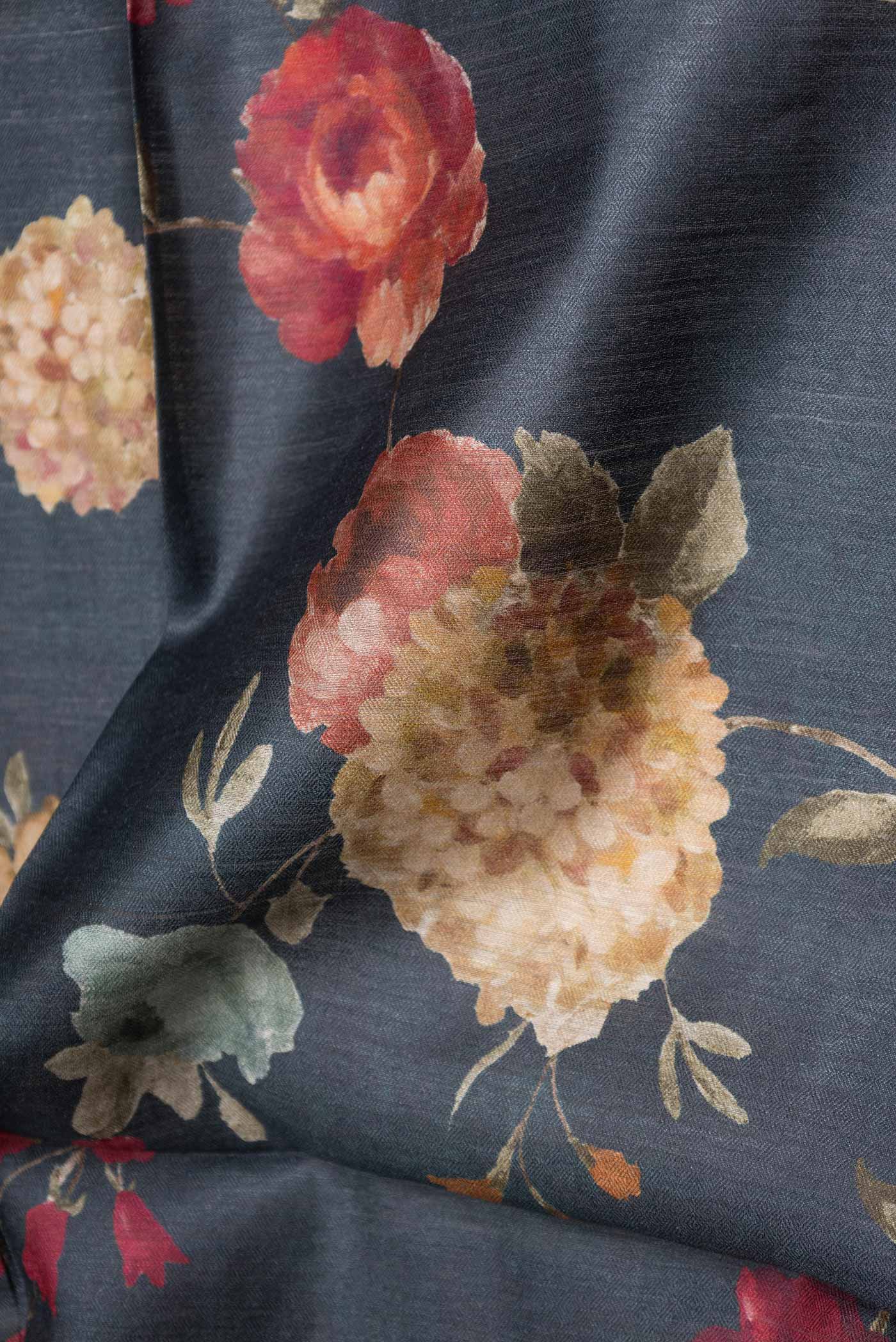Close up of Grey Dual Tone Tussar Saree with Printed design on the body and Zari Border displaying folds